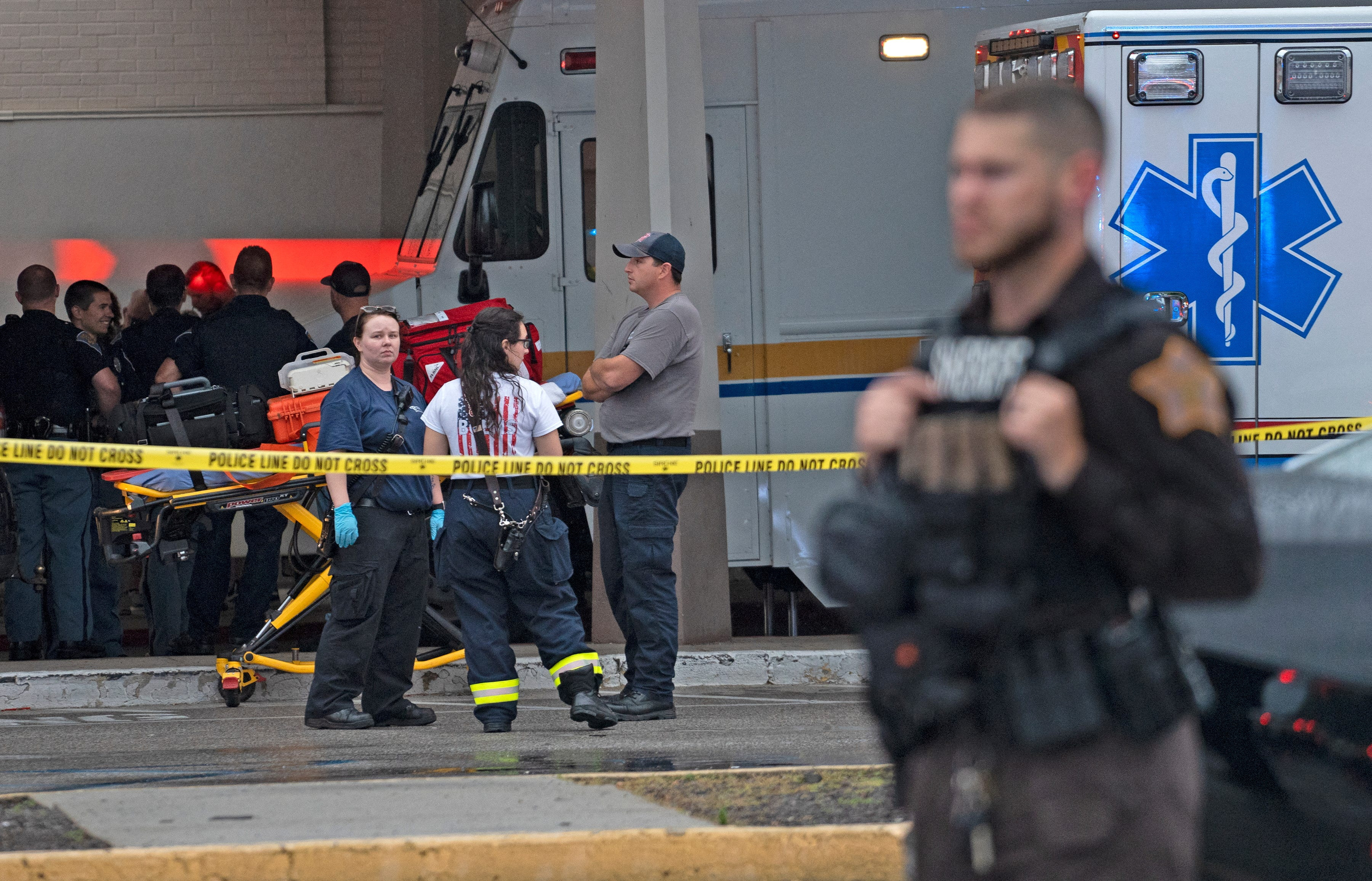 Emergency personnel gather after a shooting at Greenwood Park Mall in Greenwood, Indiana, July 17, 2022.