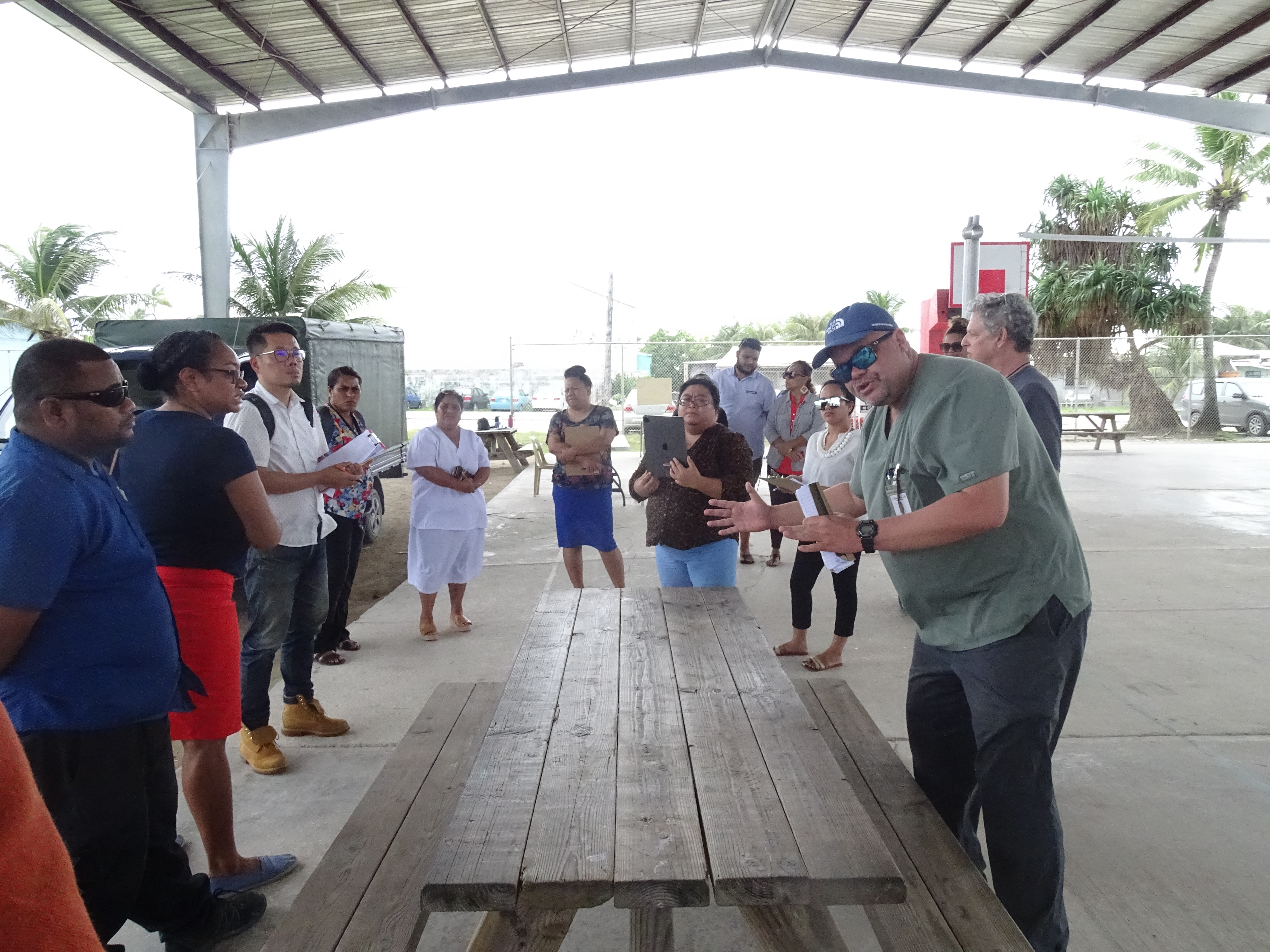 Marshall Islands Director of Public Health Dr. Frank Underwood, right, leads an exercise with health staff preparing for their response to community spread of Covid in the future.