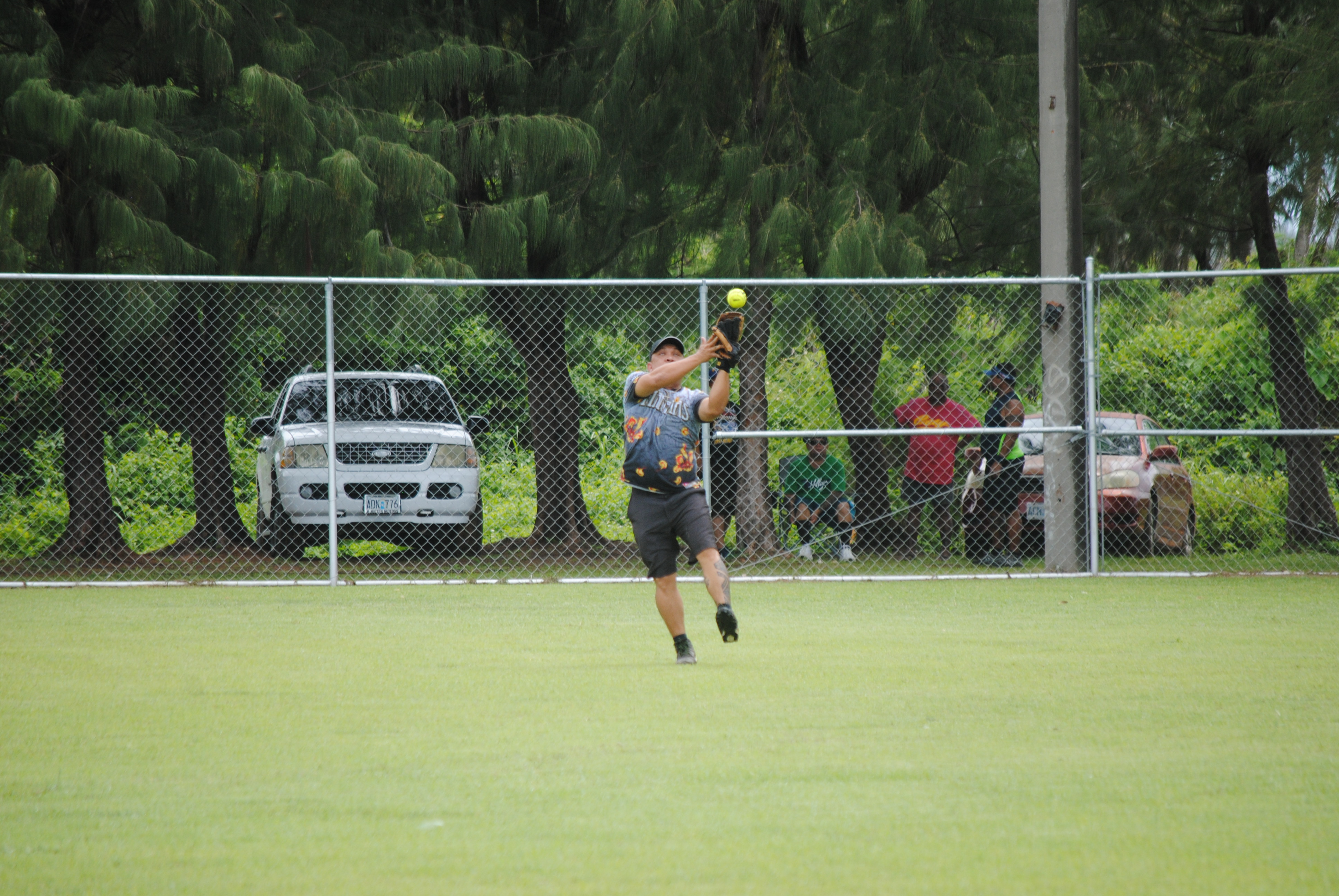 Sufa's centerfielder Kobani Deleon Guerrero catches the ball for the out during a 2022 Budweiser Belau Amateur Softball League game Sunday at the Dandan baseball field.