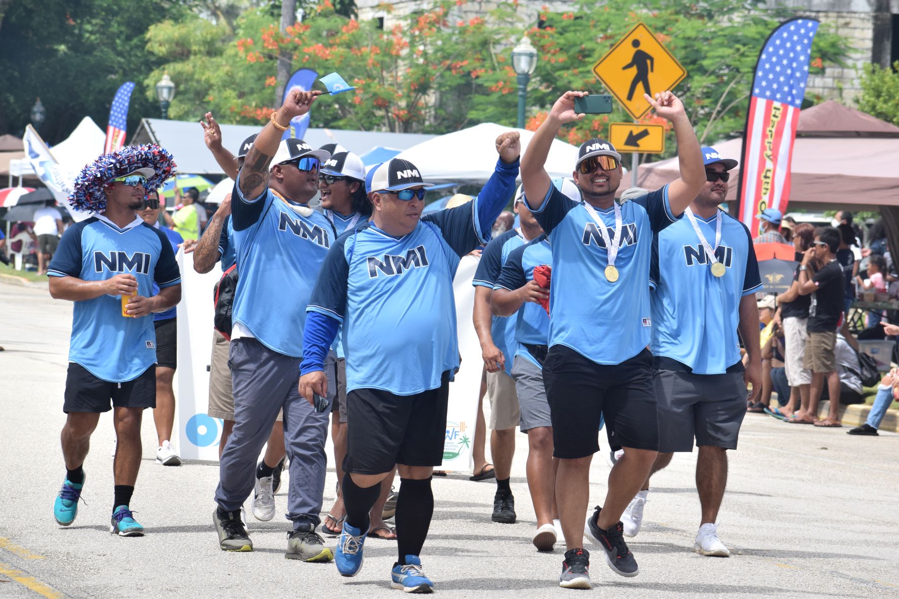 Team NMI, the 2022 Pacific Mini Games baseball gold medalists, wave at the crowd.