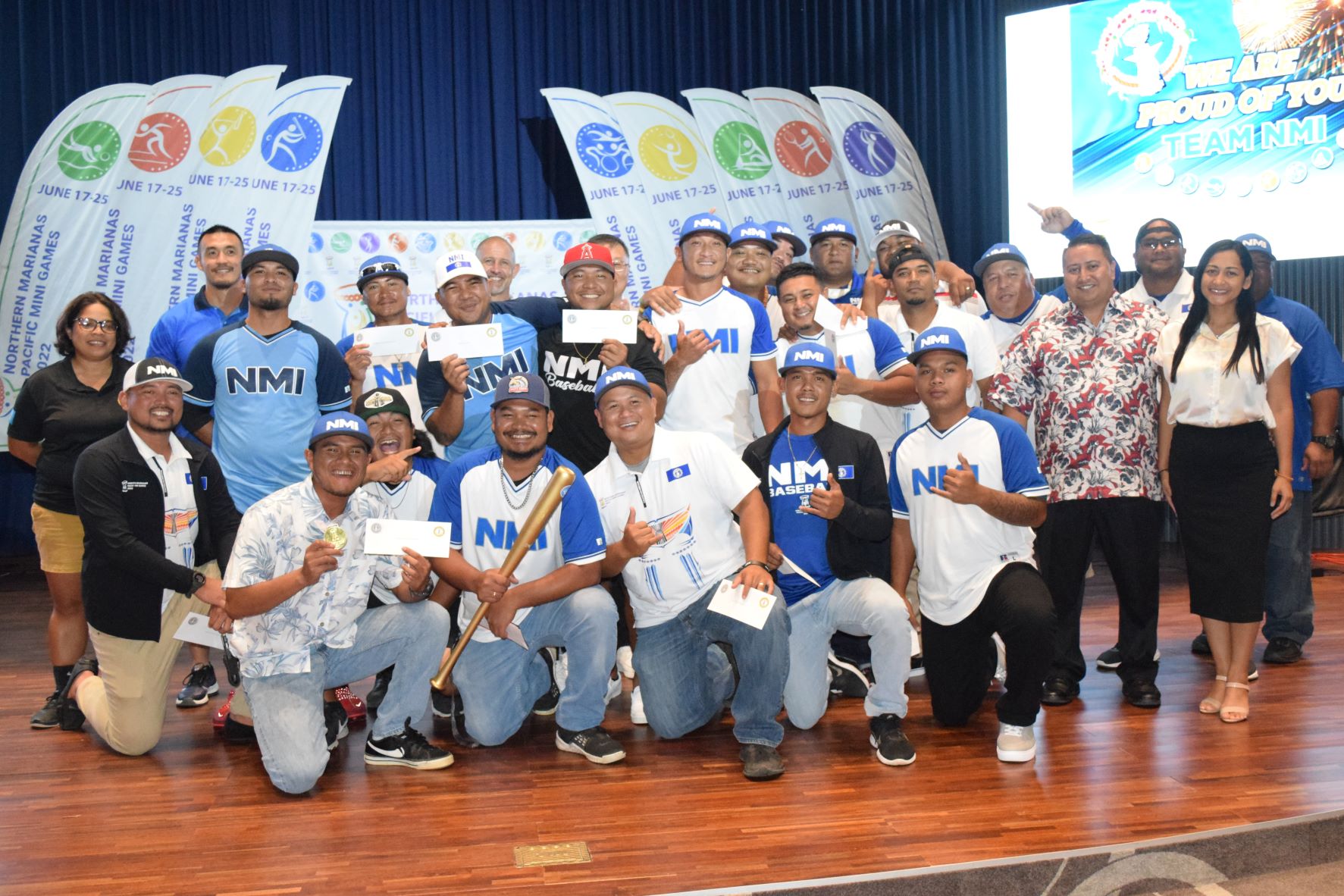 Gov. Ralph DLG Torres, second right, and First Lady Dianne Torres, right, with members of the NMI baseball team.