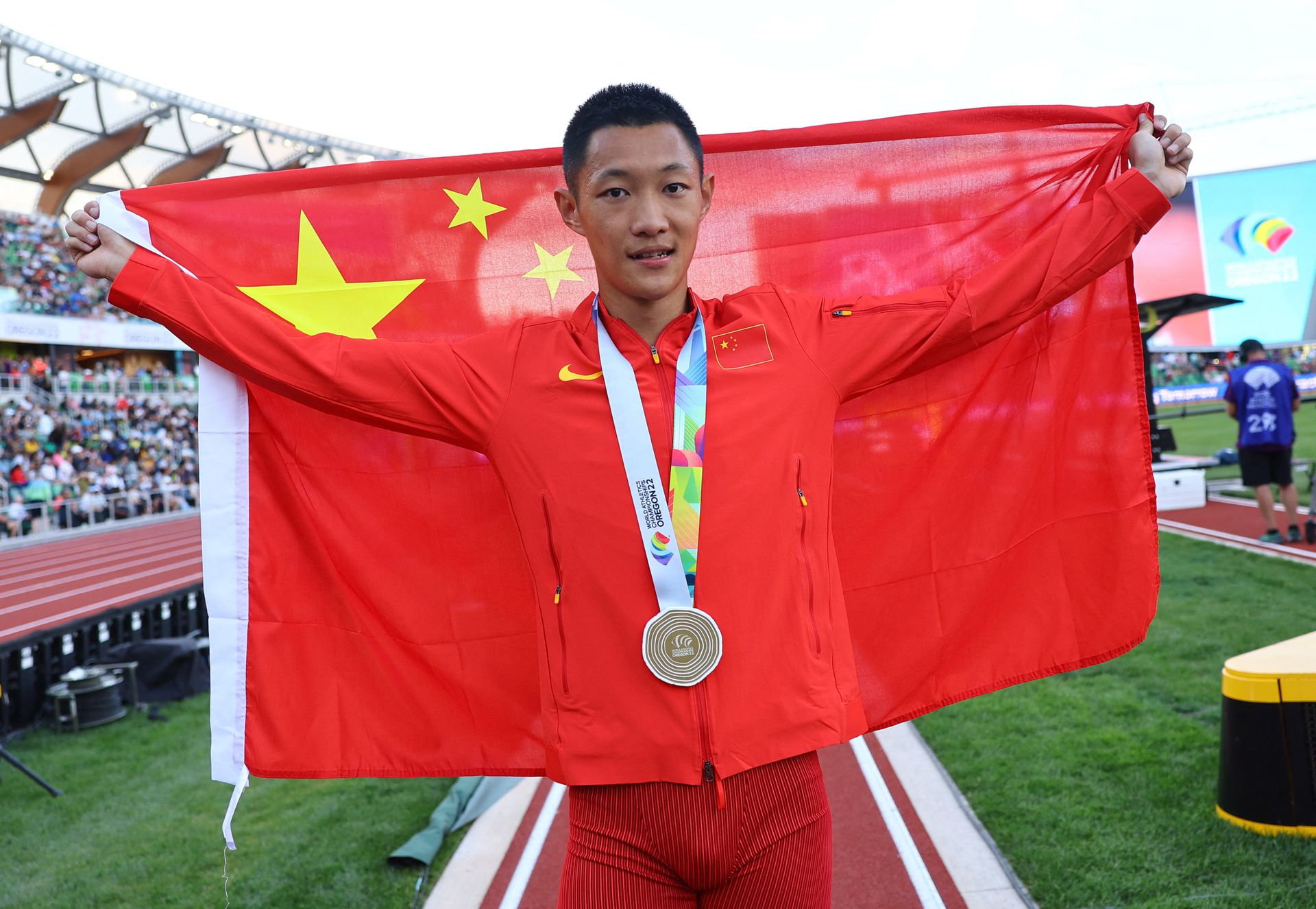 Gold medalist China's Wang Jianan celebrates after winning the men's long jump final in the World Athletics Championships at Hayward Field in Eugene, Oregon on July 16, 2022.