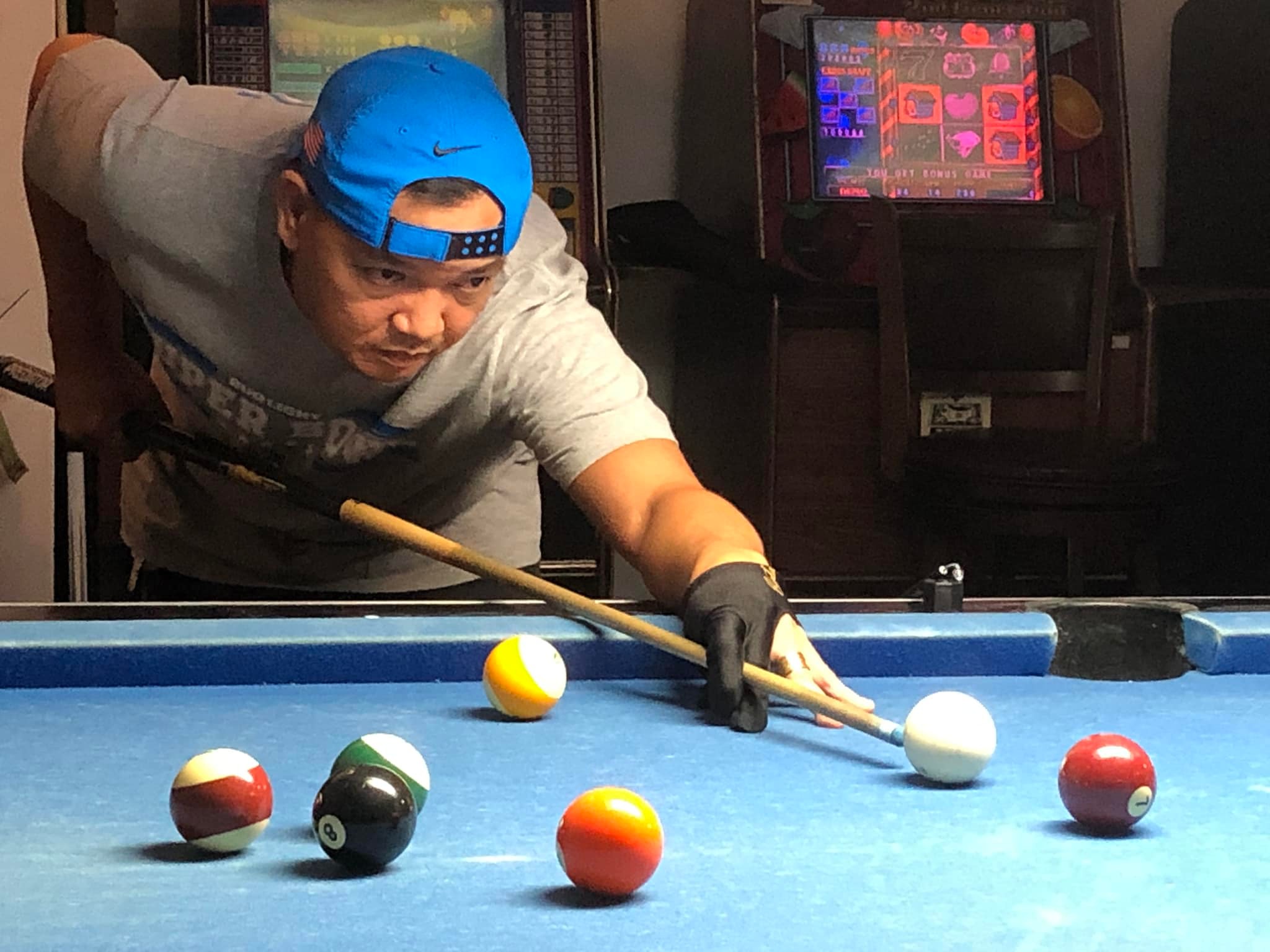 VFW IT&E Destroyers' Roman Rodriguez lines up for the shot during a Tuesday Division game of the SBA Budweiser Open 8-Ball League at the VFW Bar.