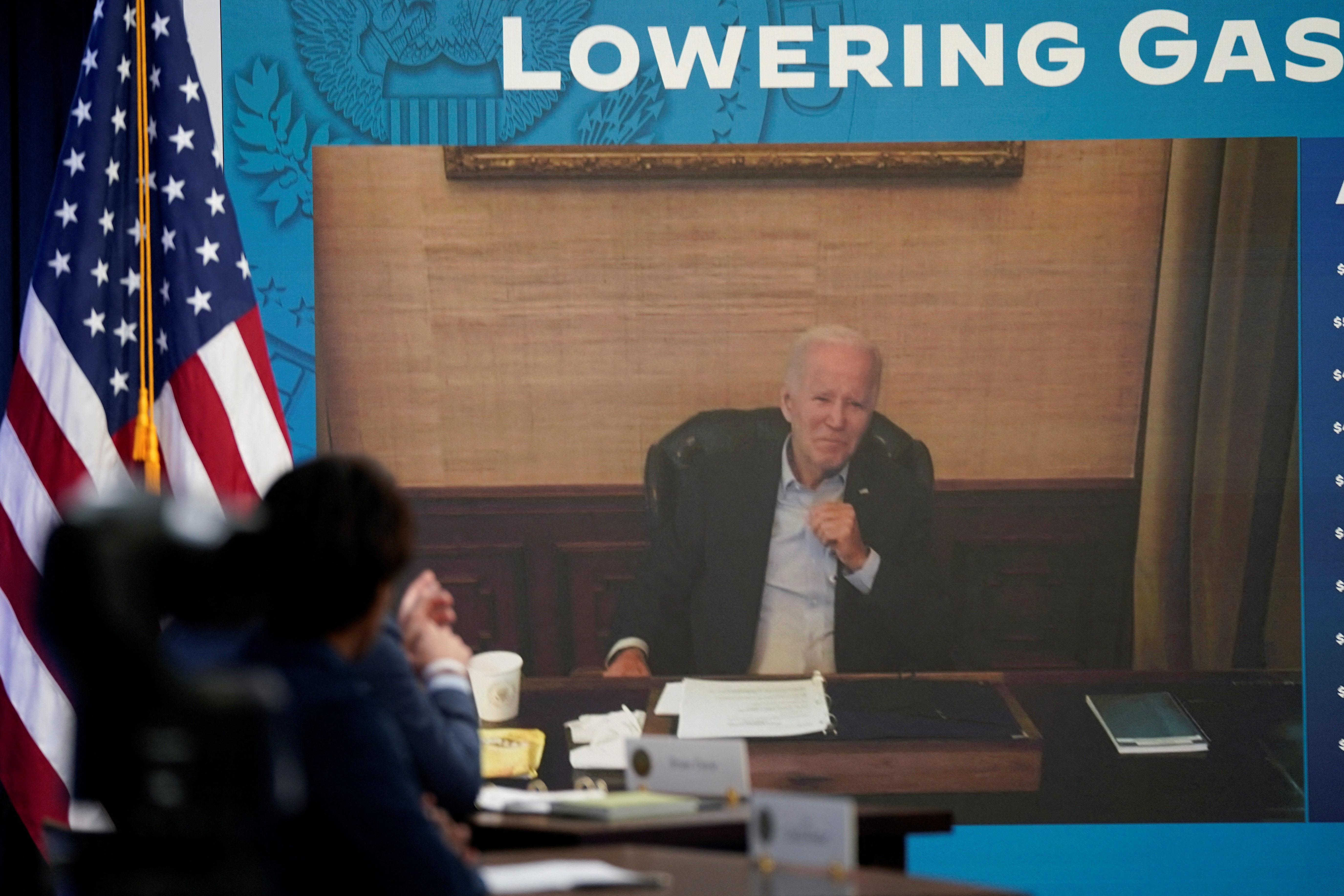 President Joe Biden, who has Covid-19, appears on a screen during a virtual meeting with his economic team at the White House in Washington, D.C., July 22, 2022.