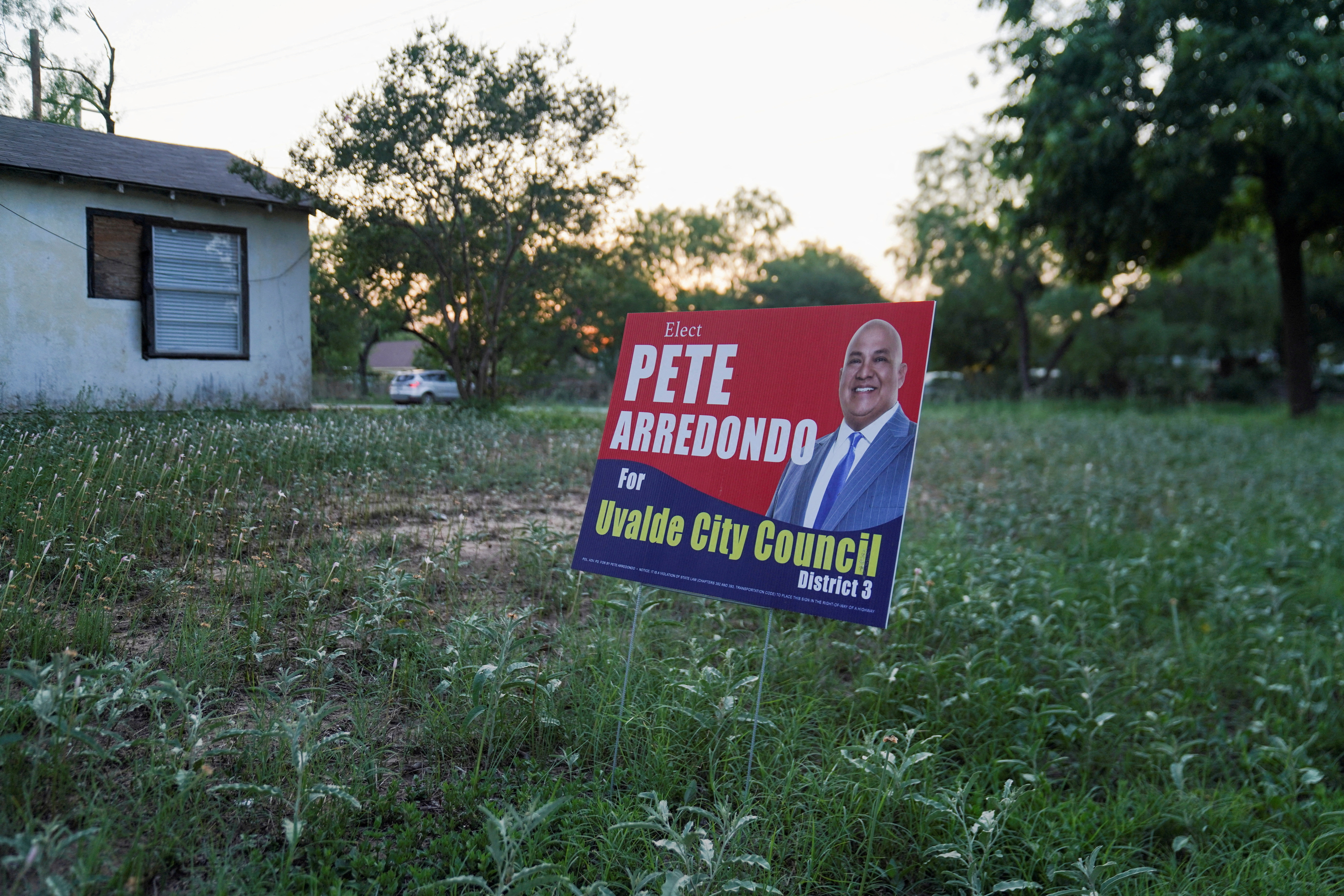 A political sign for Pete Arredondo, the Uvalde School District police chief, who had been scheduled to be sworn in with the Uvalde City Council is seen in Uvalde, Texas, U.S. on May 29, 2022.