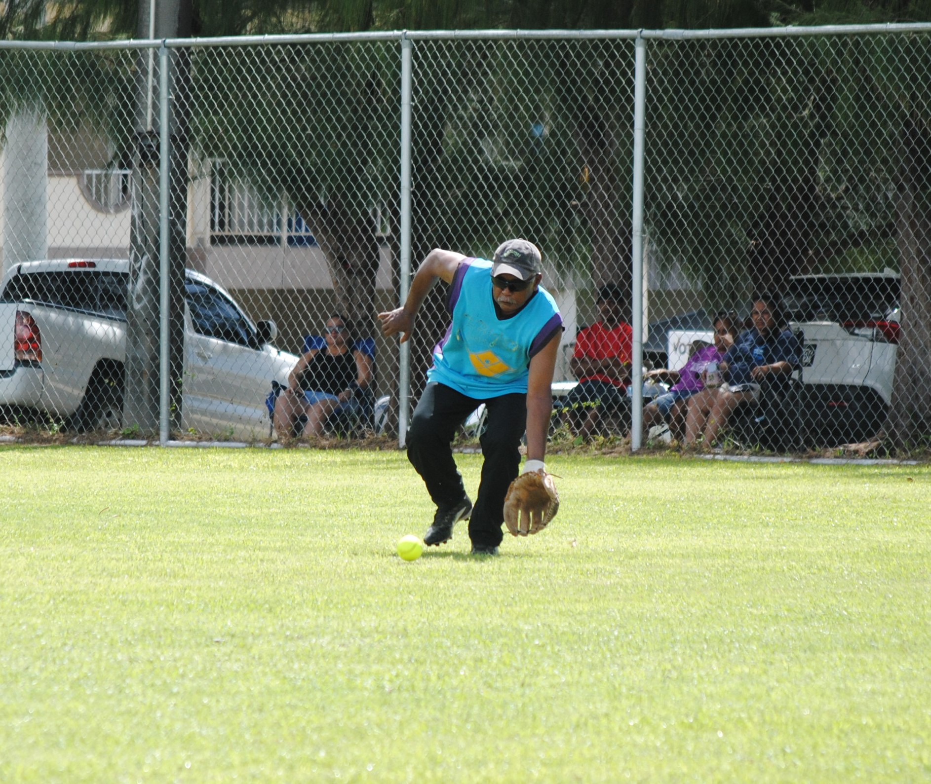Peliliu's right outfielder Mabel secures the grounder.