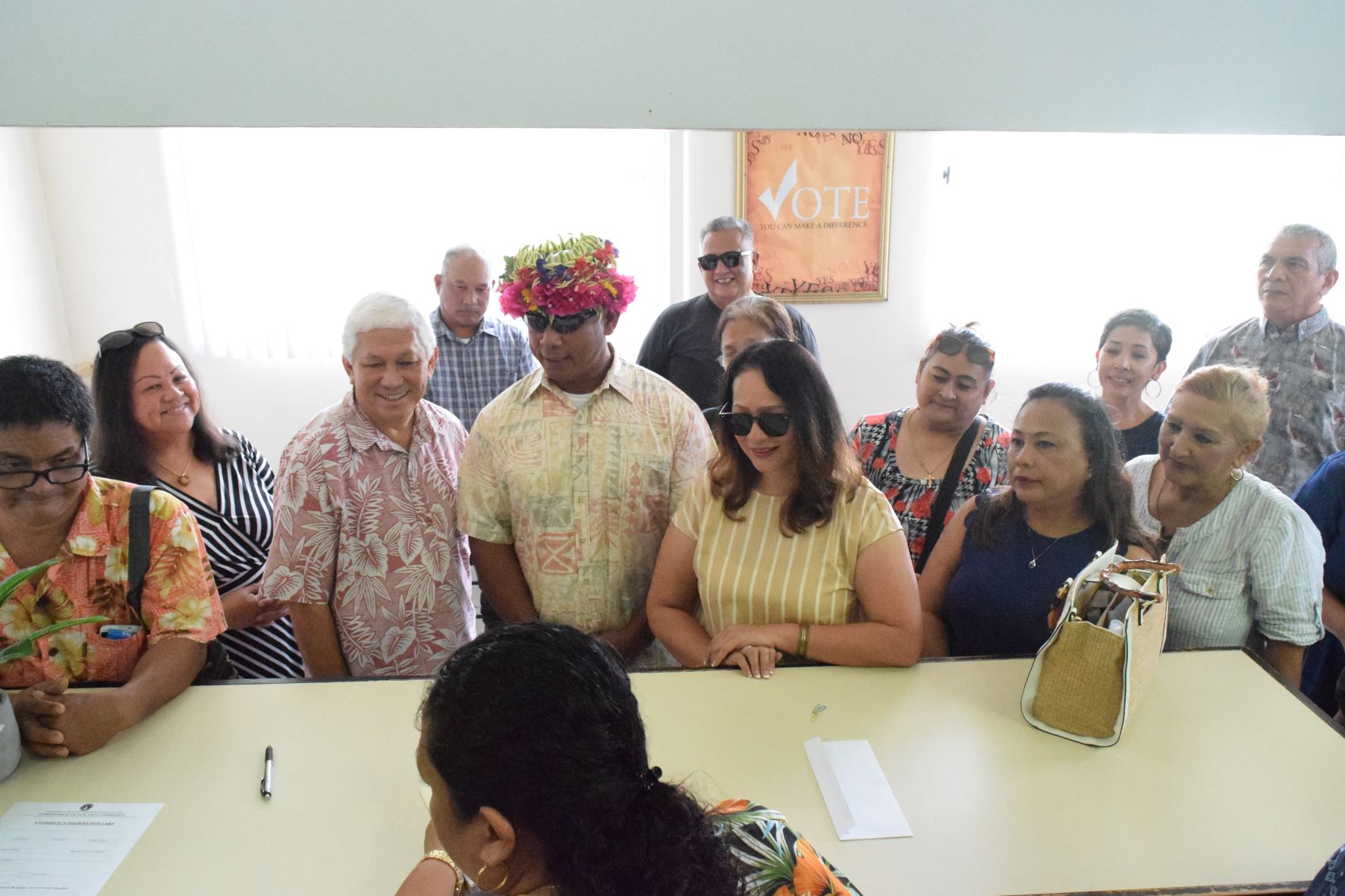 Military veteran Edward Castro Barcinas is accompanied by family, supporters and fellow independent candidates in filing his candidacy for Rota’s seat in the House of Representatives at the Commonwealth Election Commission Thursday.