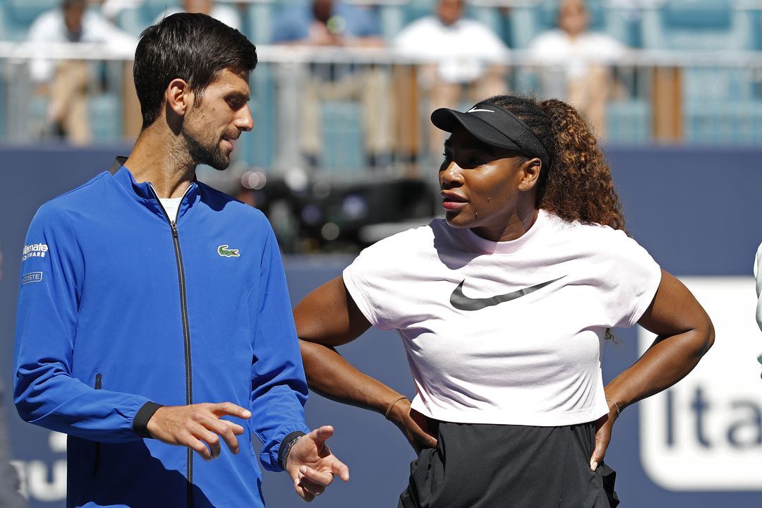 Novak Djokovic of Serbia speaks to Serena Williams of the United States during a ribbon-cutting ceremony for a new stadium court at Hard Rock Stadium prior to play in the first round of the Miami Open at Miami Open Tennis Complex, Miami Gardens, Florida on  March 20, 2019.