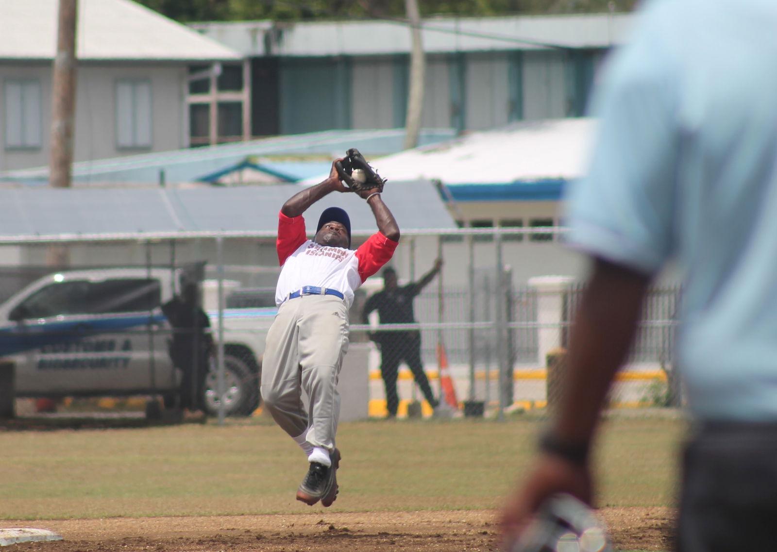 The Solomon Islands' second baseman catches the ball during a 2022 Pacific Mini Games baseball game at the Tan Ko Palacios baseball field.
