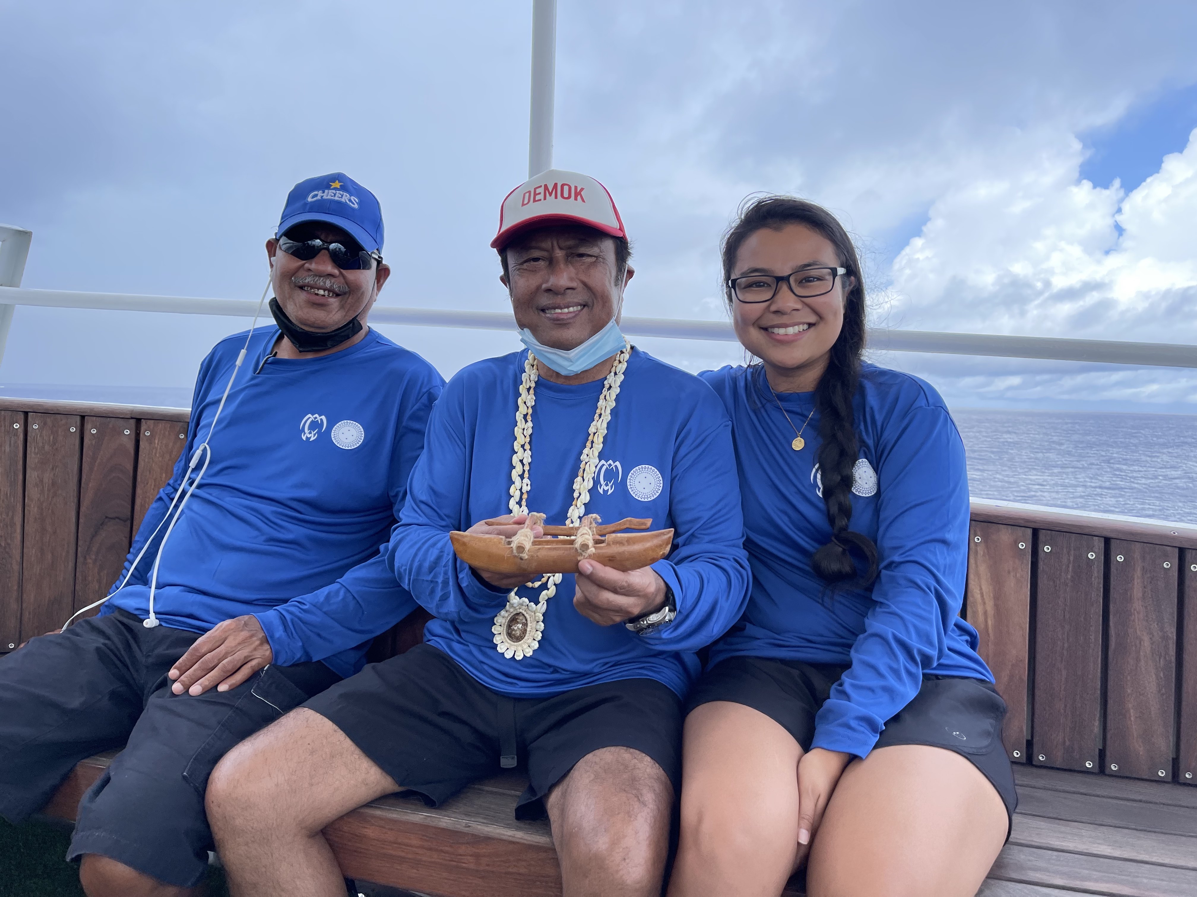 Sesario Sewralur, former Palau President Tommy Remengesau Jr.  and Nicole Yamase hold items that were on board for all three of their dives to the trenches.