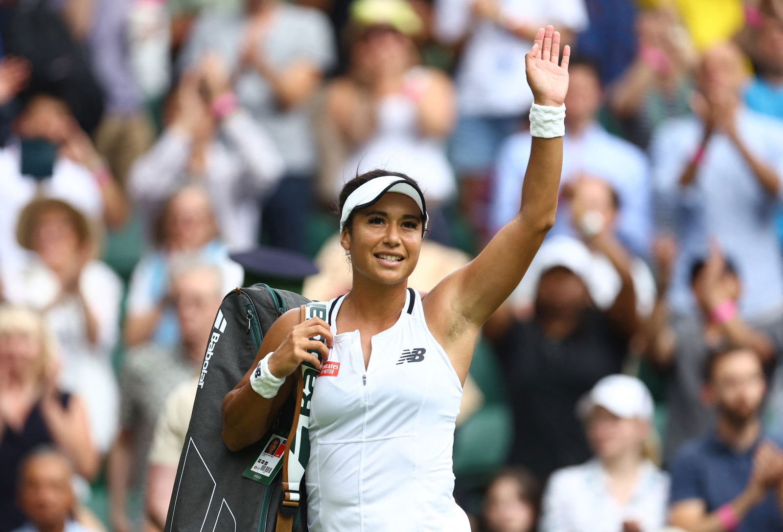 Britain's Heather Watson acknowledges the crowd after losing her fourth round match against Germany's Jule Niemeier  at Wimbledon on July 3, 2022.