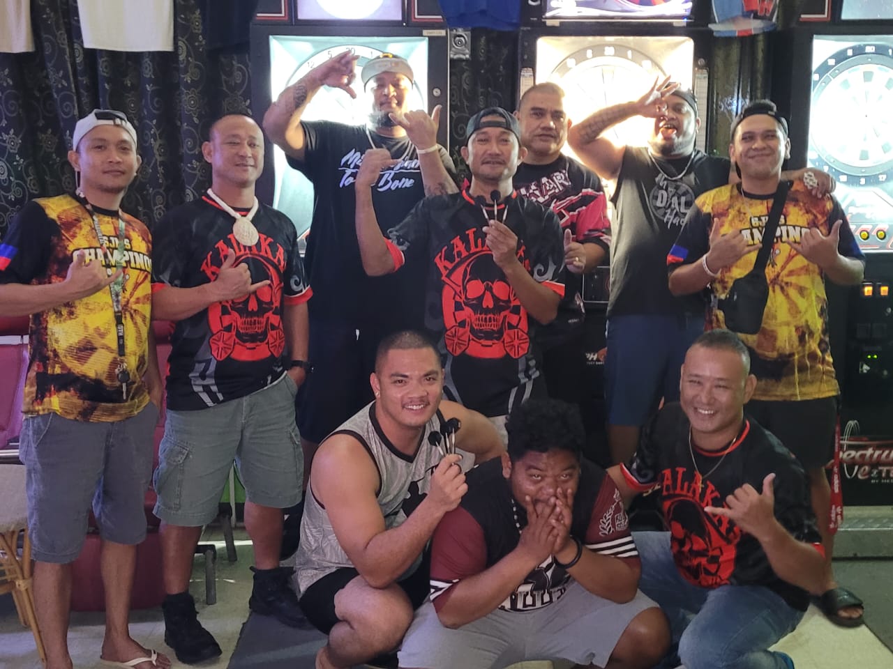 Just Chillin' Kalakas and the 6JMS Champinos pose for a photo after their match in the Latte Stone Tuesday B Division of the SEDA Bud Light Dart League  on Tuesday at the 6JMS Sports Bar.
