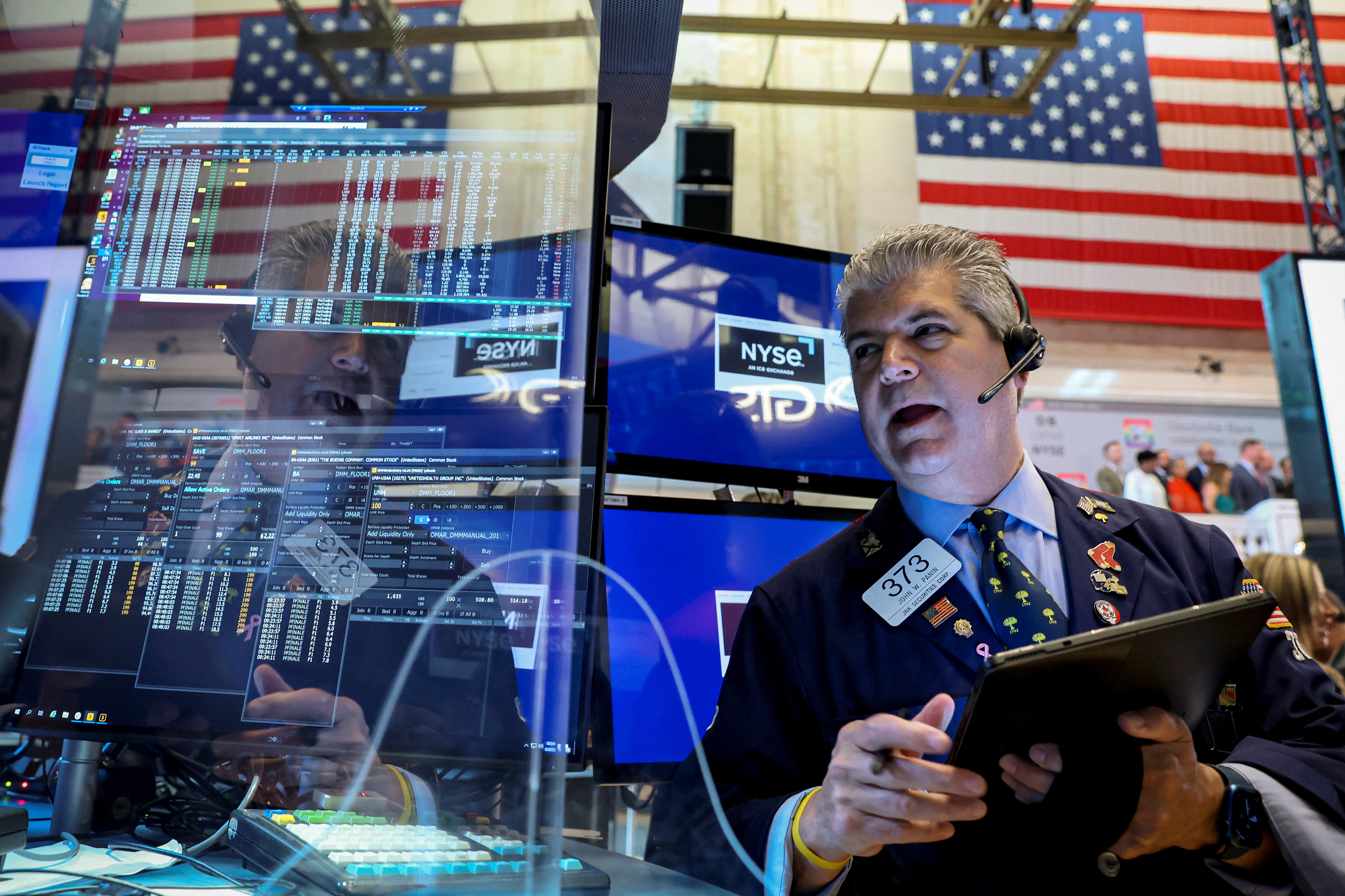 Traders work on the floor of the New York Stock Exchange in New York City, June 30, 2022.