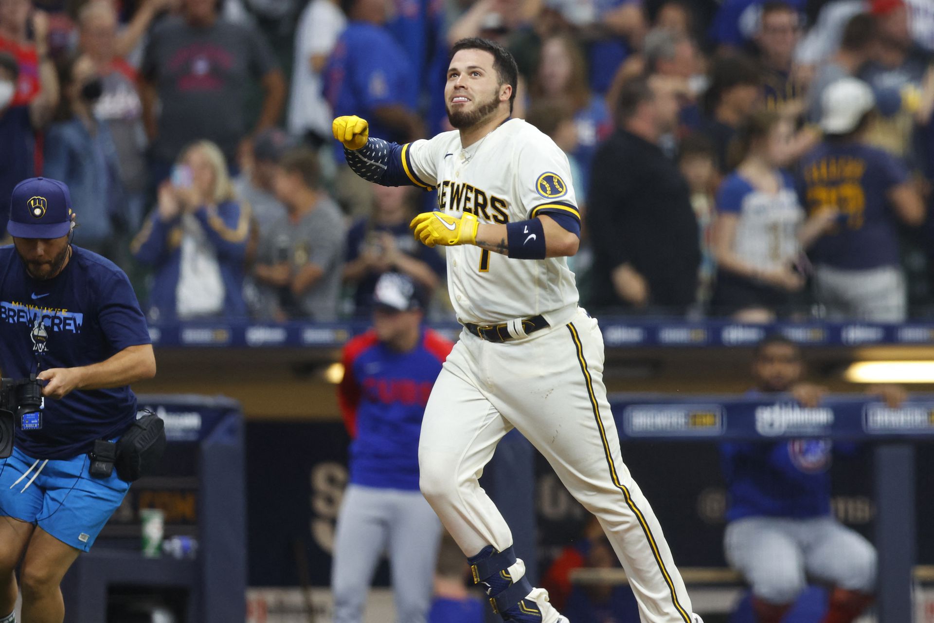 Milwaukee Brewers catcher Victor Caratini (7) celebrates after hitting a three run home run during the tenth inning against the Chicago Cubs at American Family Field in Milwaukee, Wisconsin, July 4, 2022.