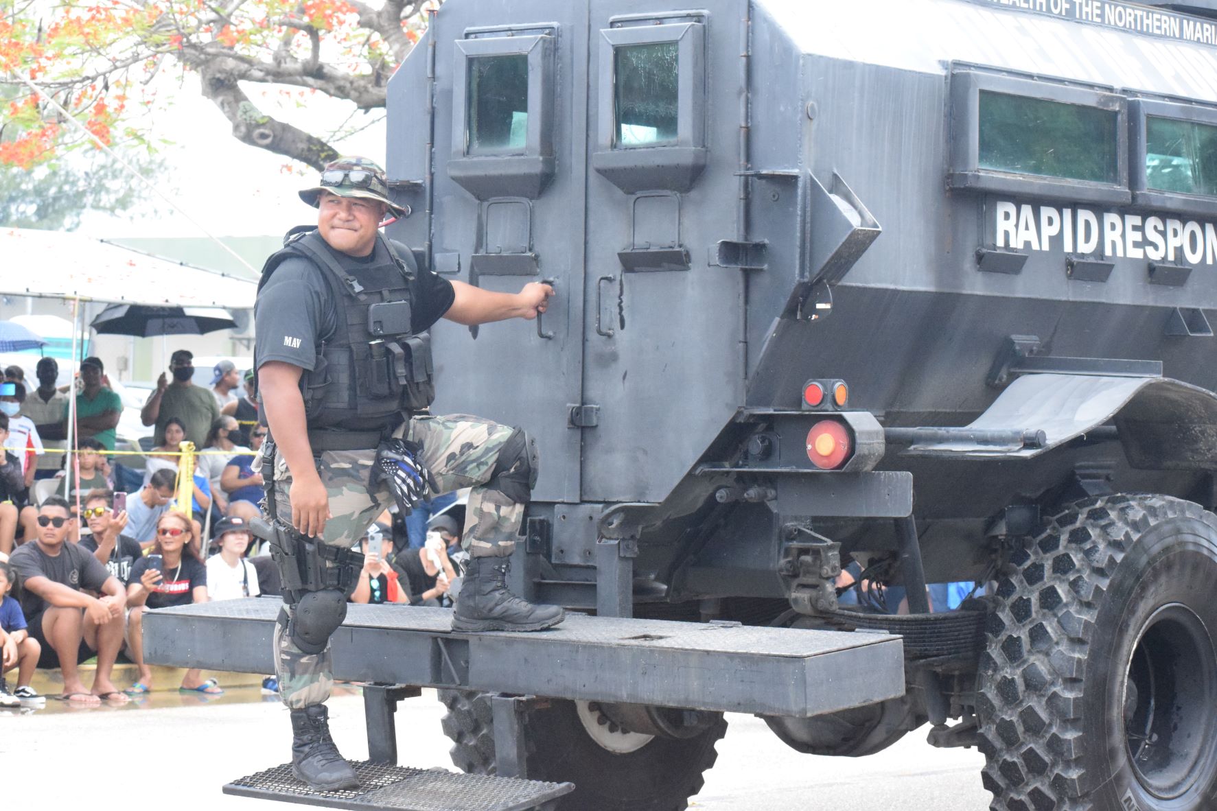 A CNMI Department of Public Safety officer rides on a Rapid Response vehicle.