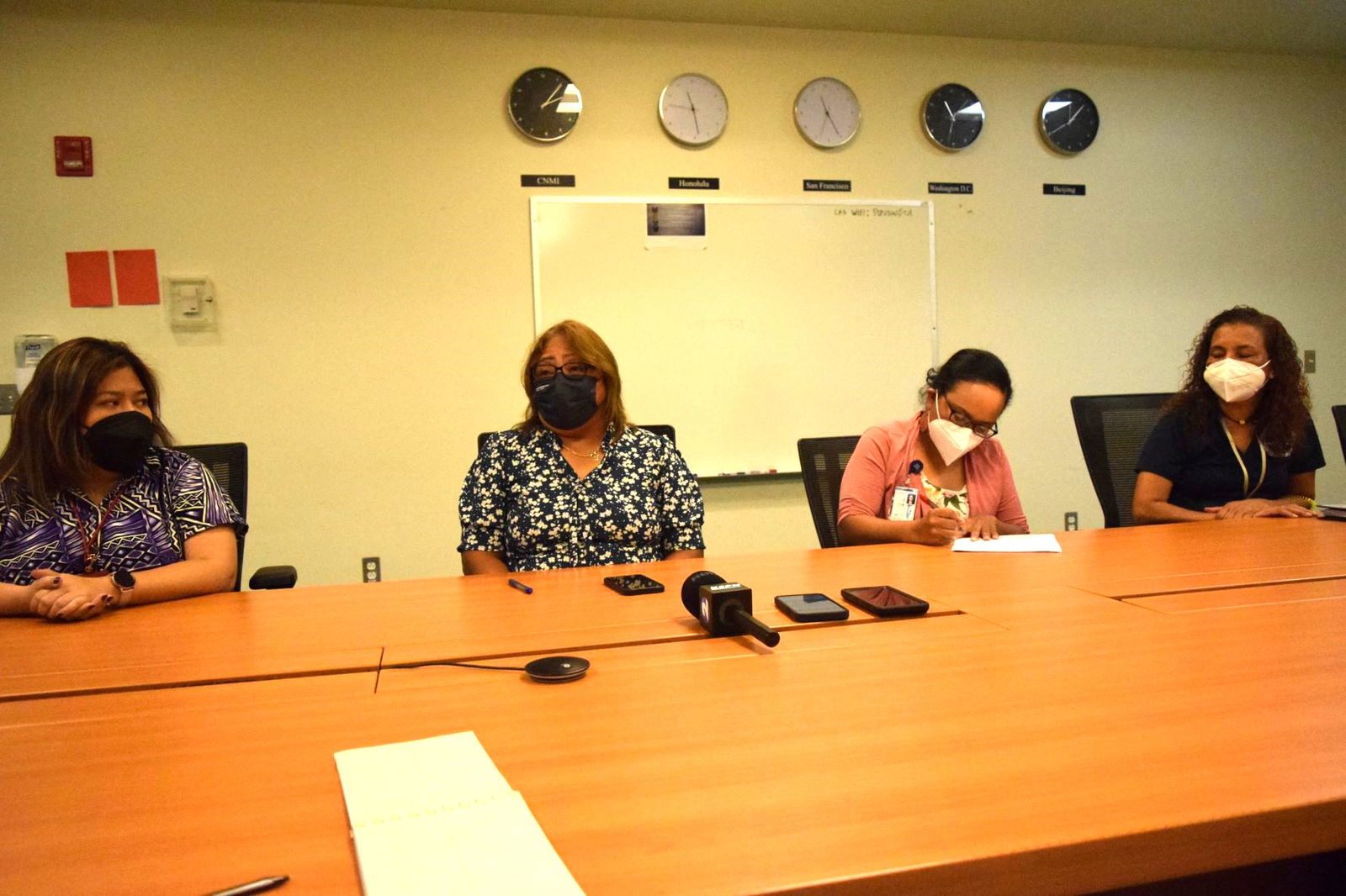 Commonwealth Healthcare Corp. Chief Executive Officer Esther L. Muna, second left, speaks as Chief Financial Officer Perlita Santos, left, Medical Referral Program Director Carmiline Ogumoro, second right, and staff member Rose Camacho listen during a press conference on Monday in the CHCC conference room.