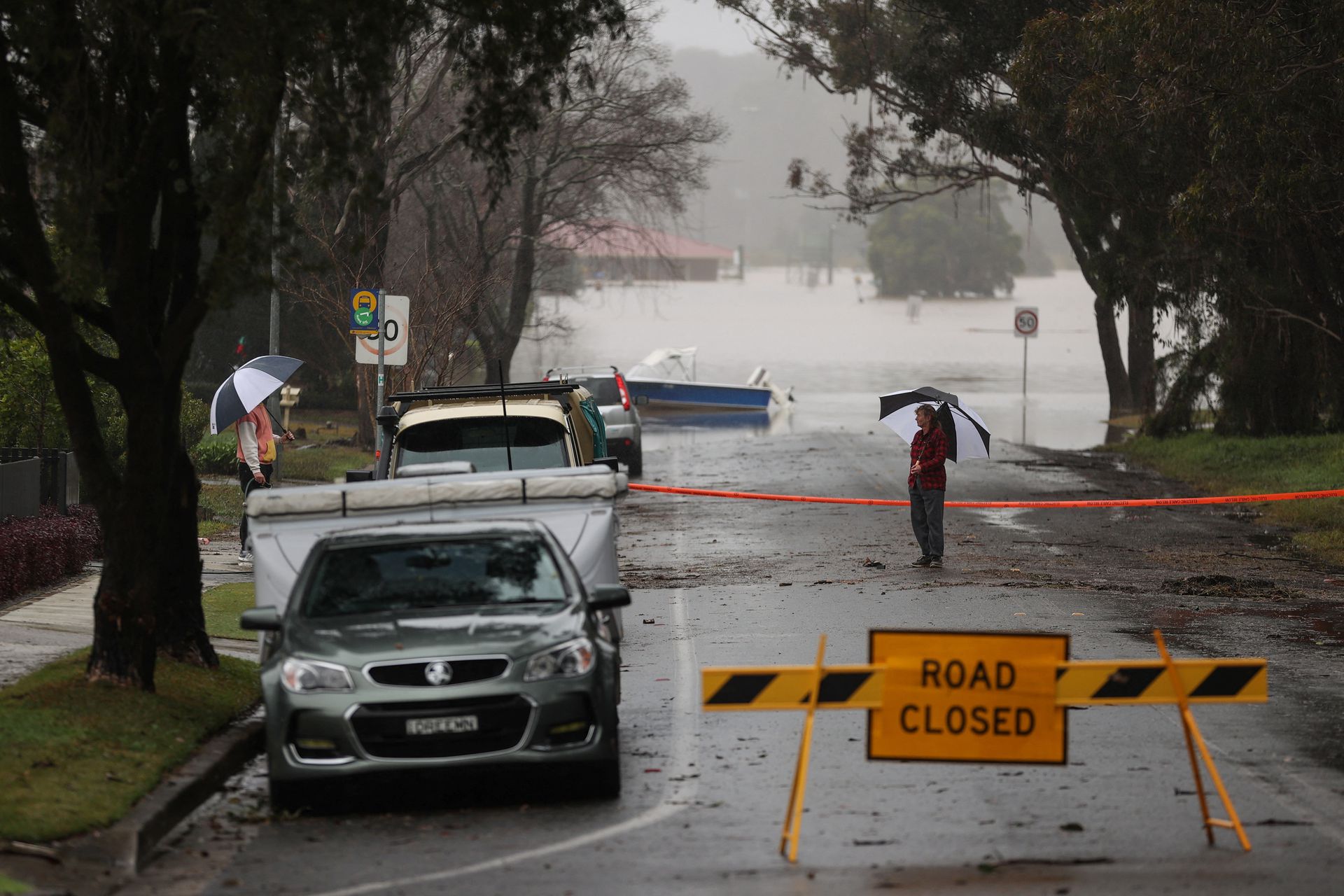 Floodwaters begin to recede after inundating a residential area, following heavy rains and severe flooding in the McGraths Hill suburb of Sydney, Australia, July 6, 2022.