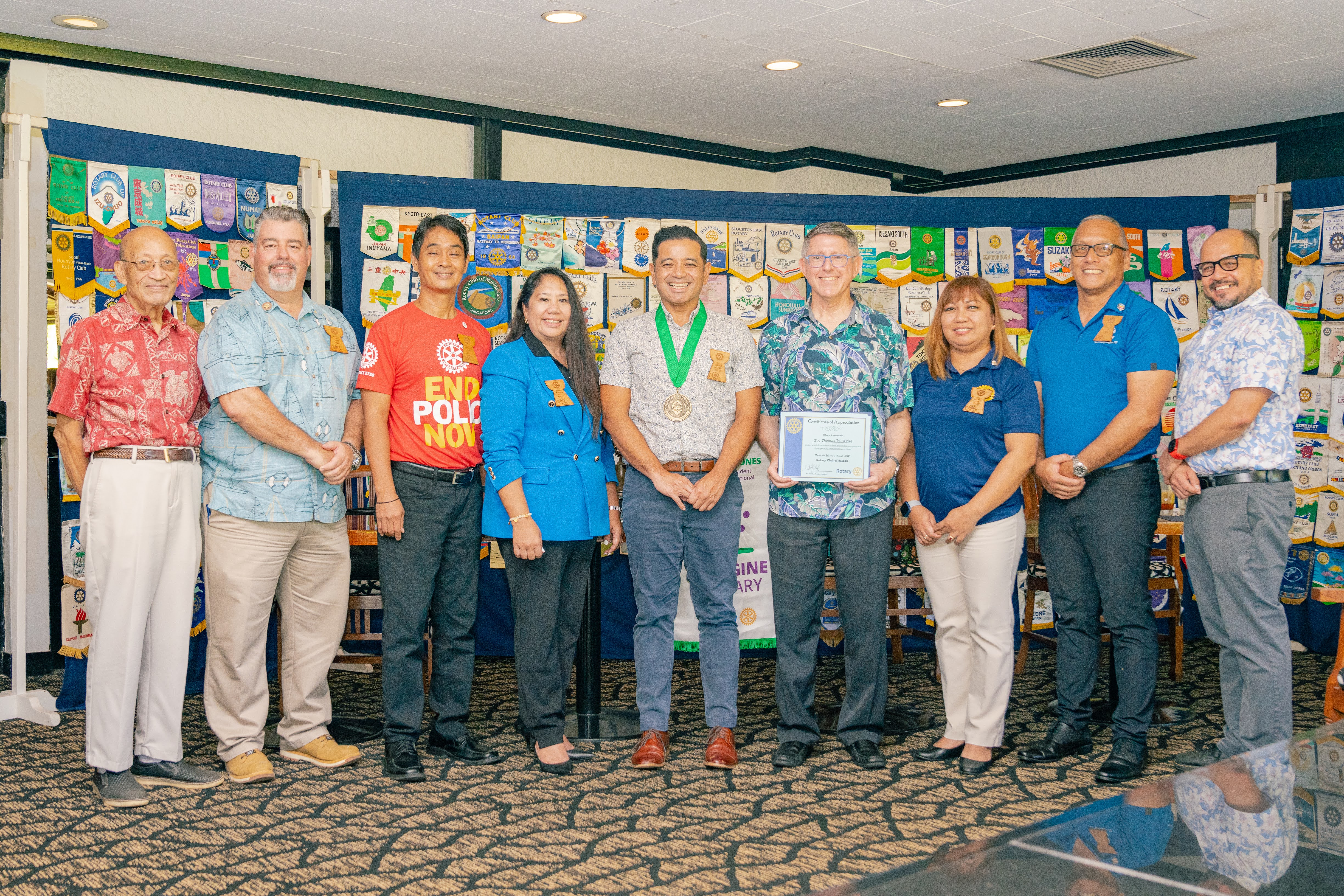 Frankie Eliptico, Northern Marianas College vice president for administration and advancement, center, was awarded the University of Guam’s “Milåyan Presidenten” or The President’s Medal by UOG President Dr. Thomas W. Krise at the Saipan Rotary Club’s meeting on Tuesday, August 10, 2022. In photo with Eliptico from left are Rotarians Dave Sablan and Mario Valentino, Rotary Club President Wendell Posadas, Rotarian Joann Aquino, UOG President Dr. Thomas W. Krise, Rotarian Jessy Loomis, NMC Board of Regents Chairperson and Rotarian Charles V. Cepeda, and NMC President Galvin Deleon Guerrero, EdD.