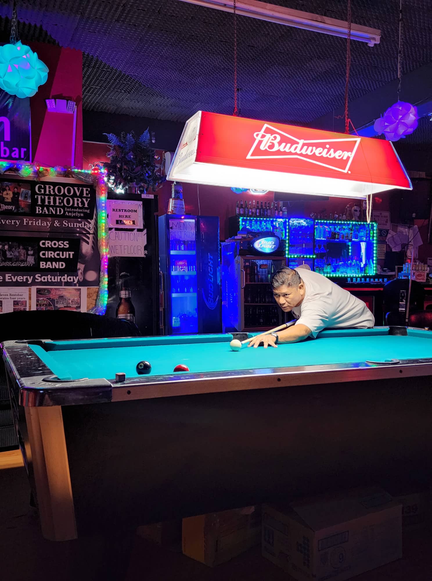 Last Shot Eleven Tiger's Raymond David lines up for the shot during a Thursday Division game of the SBA Budweiser Open 8-Ball League at 9 Eleven Restobar.