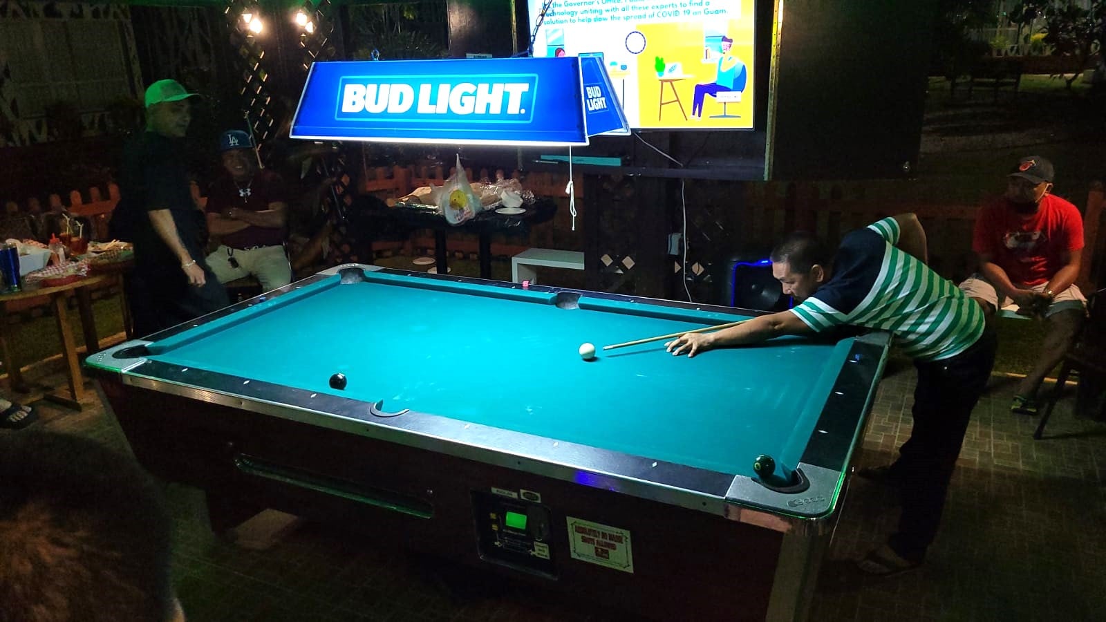Lito Pangilinan aims for the 8-ball during a New Bamboo Bar 8 Ball Tournament game at Bamboo Bar, Saipan Vegas.