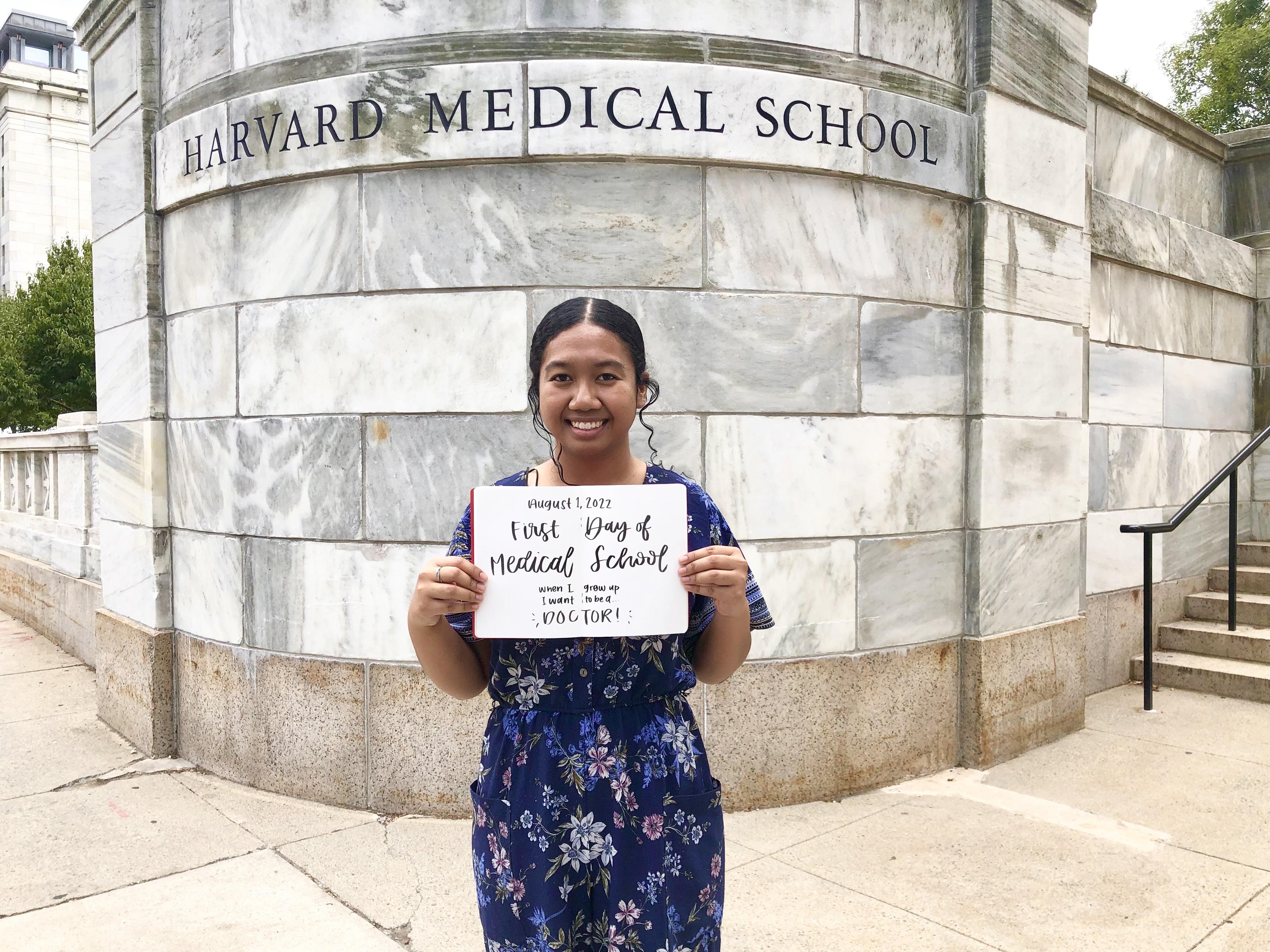 Megan Gimmen commemorates her first day of medical school with a photo on the Harvard Medical School campus. The Merit Scholar and two-time valedictorian from Guam began a four-year Doctor of Medicine program on Aug. 1.