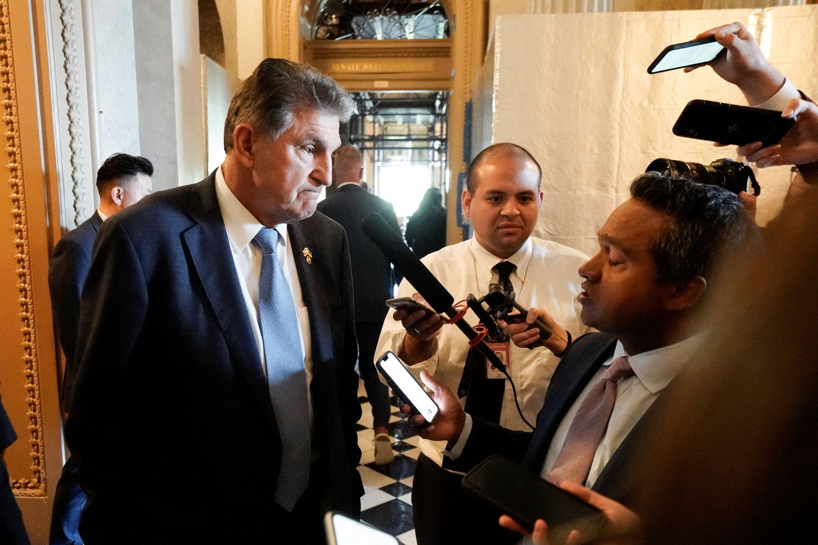 U.S. Sen. Joe Manchin, D-W.V., speaks with reporters after walking off the Senate floor during voting for the "Inflation Reduction Act of 2022," at the U.S. Capitol in Washington, D.C., Aug. 7, 2022.