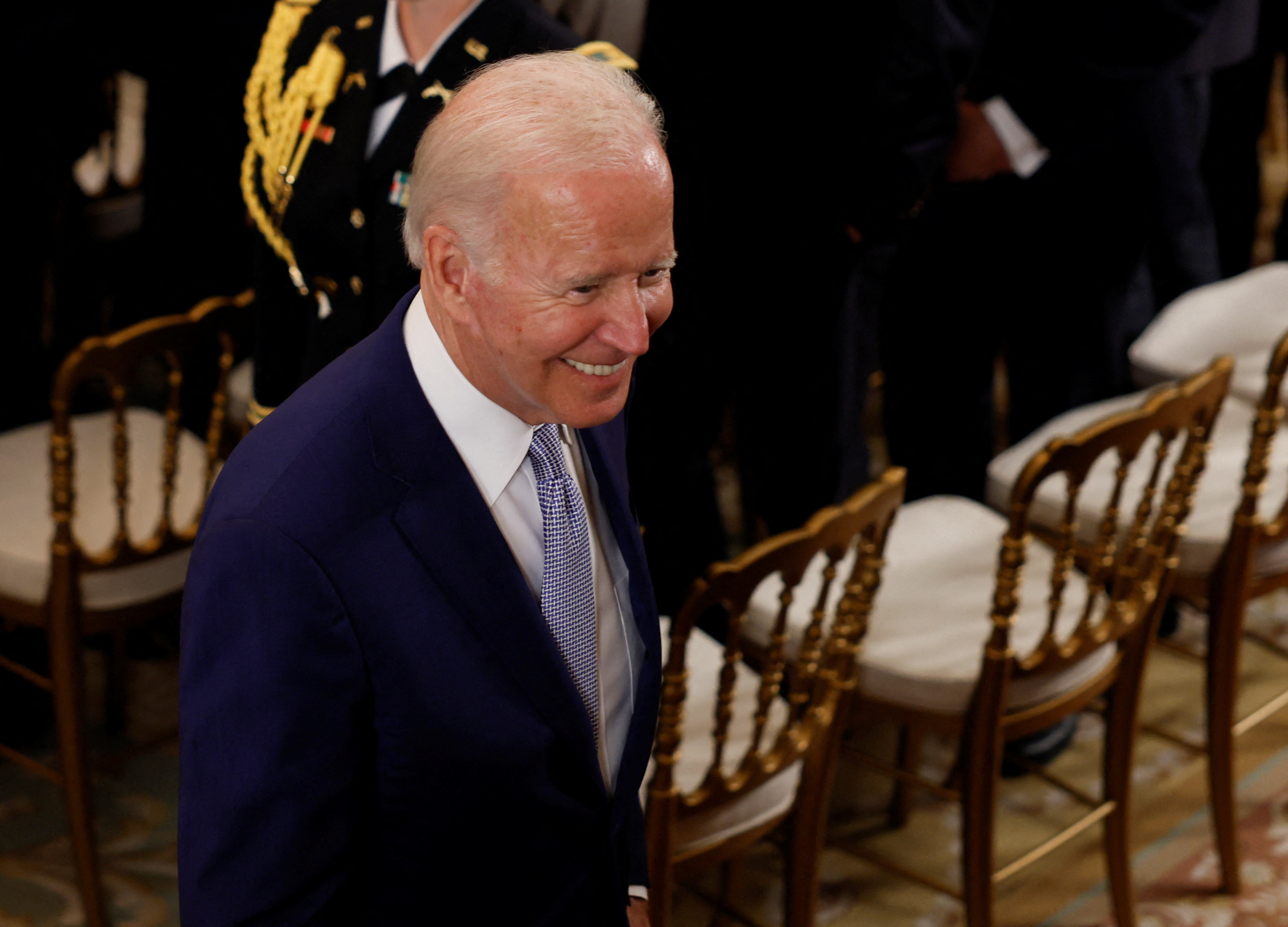 President Joe Biden smiles during a media event in the East Room of the White House, in Washington, D.C., Aug. 9, 2022.