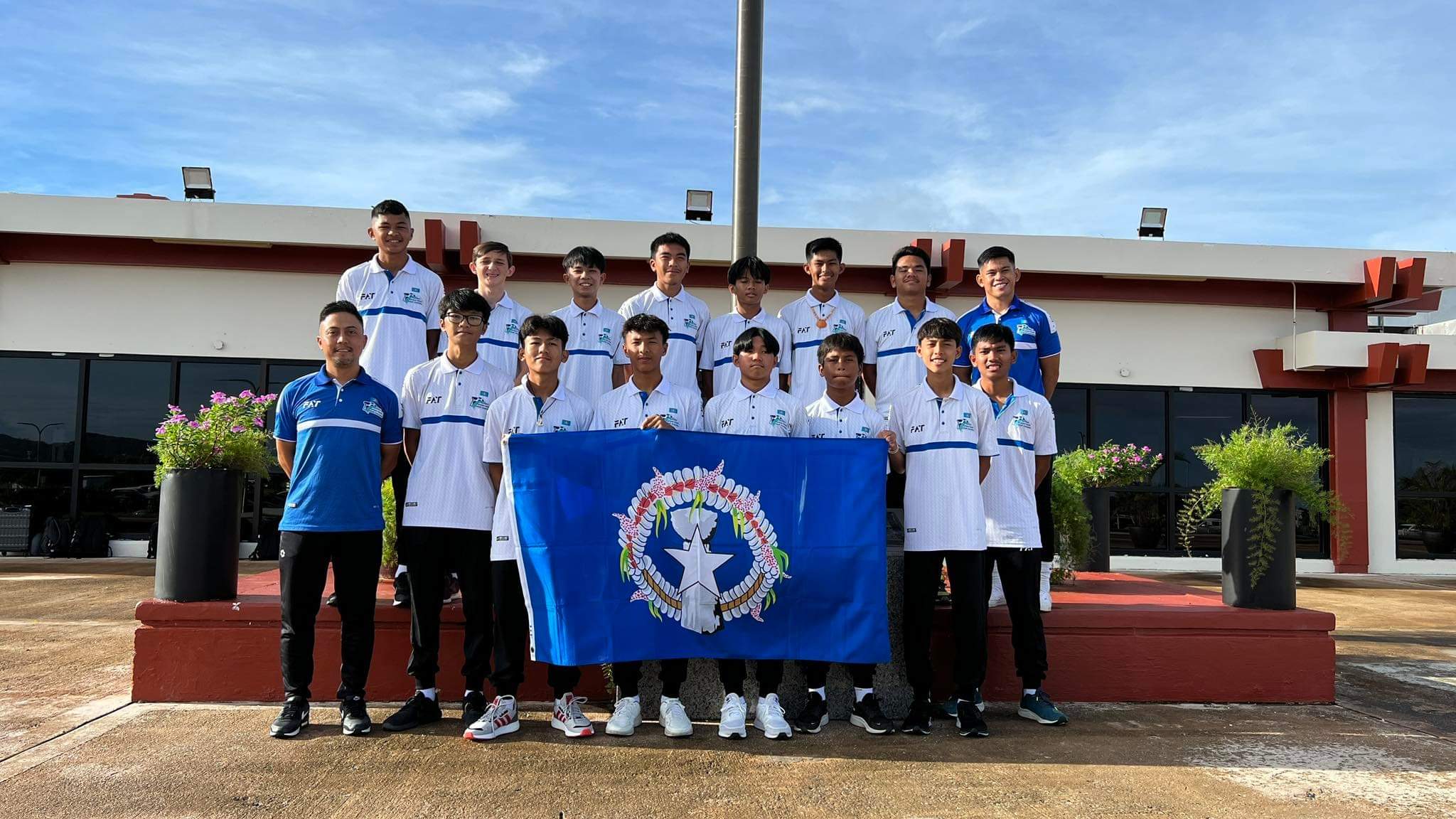 The NMI men's U17 national soccer team members pose for a photo at the Saipan airport before their departure Friday to a training camp in the Philippines.