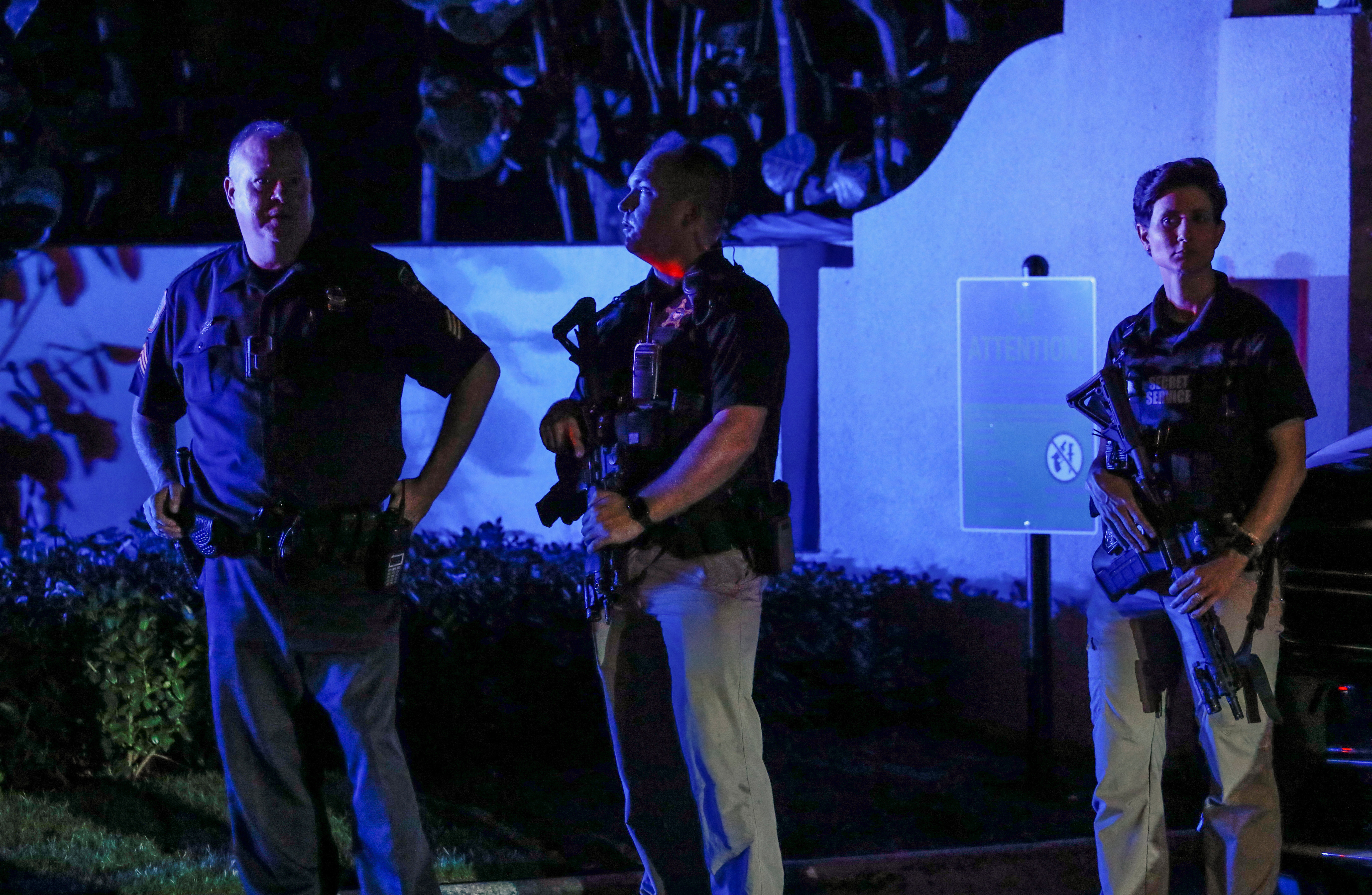 Secret service members stand guard outside former President Donald Trump's Mar-a-Lago home after Trump said that FBI agents raided it, in Palm Beach, Florida, Aug. 8, 2022.