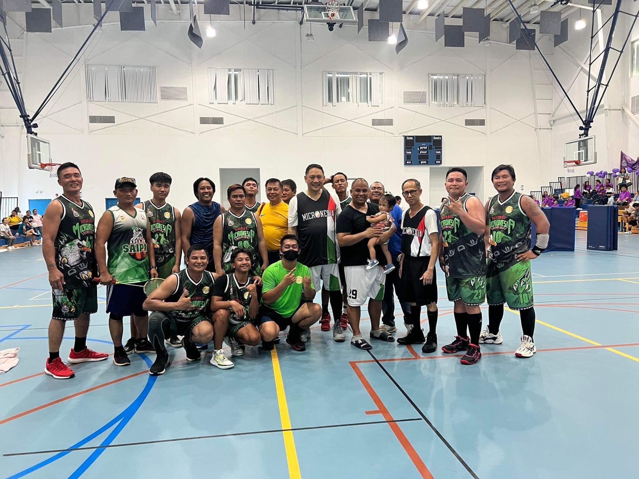 Team Green members pose for a photo after winning the championship of the 2022 Church is Christ Unity Games  on Sunday at the Marianas High School gym.
