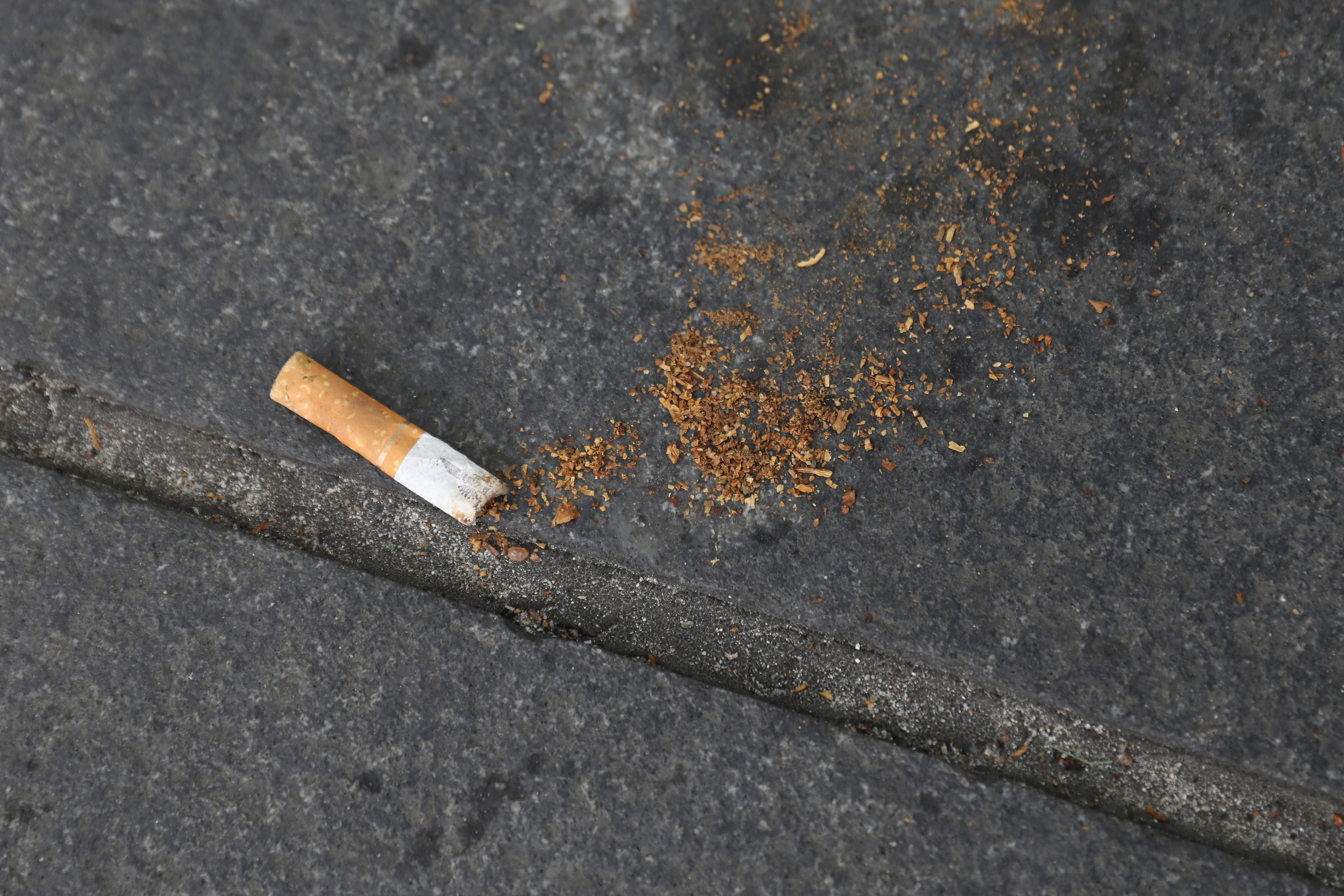A cigarette butt lies on a street in New York, May 10, 2017.