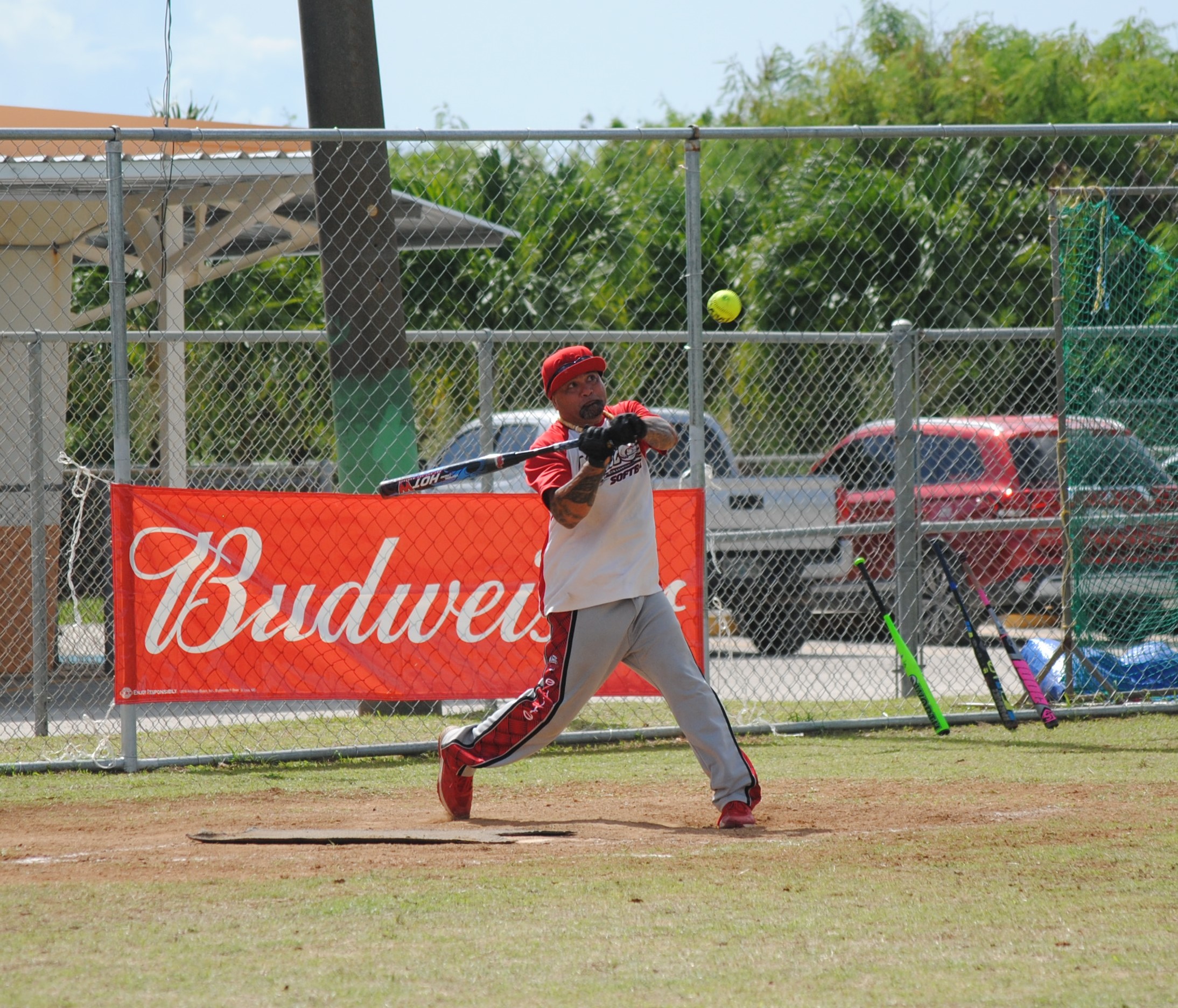 Man Amigos' James Fleming connects the single during a 2022 Budweiser Belau Amateur Softball League game at the Dandan baseball field.