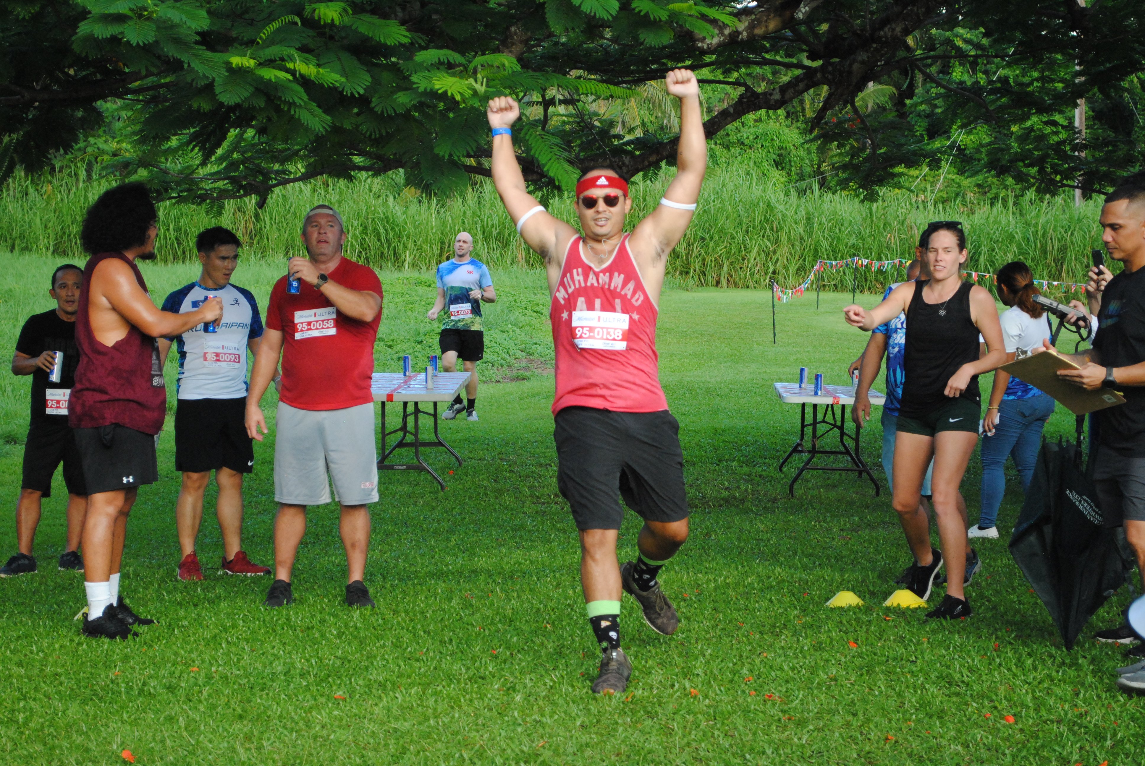 Demetrius Borge raises his hands as he finishes second.