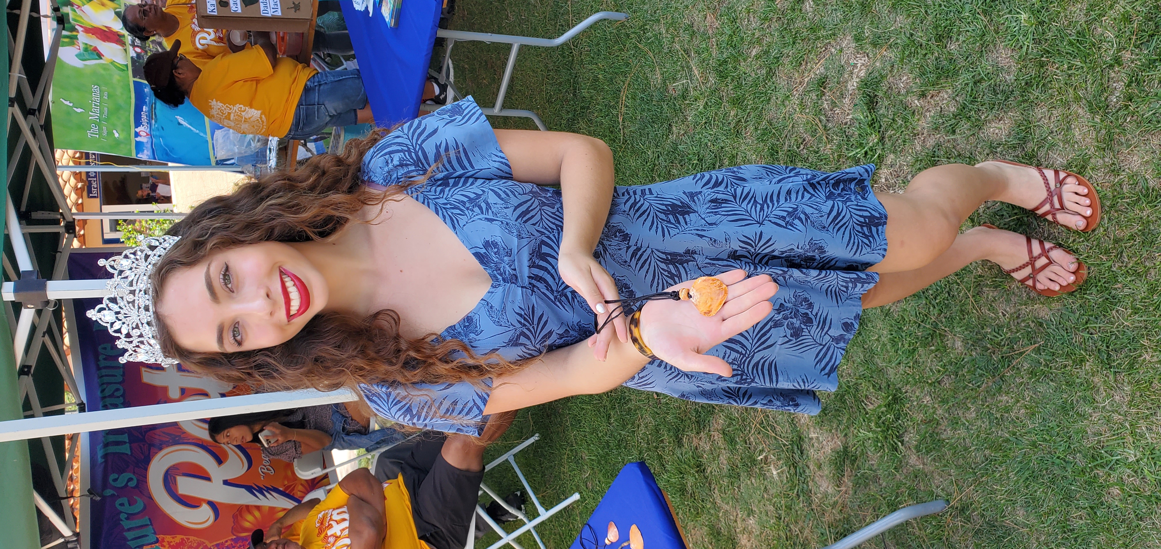 House of Chamorros Queen Sophia Gogue smiles as she showcases local shell jewelry from Tinian during the Hafa Adai Festival.