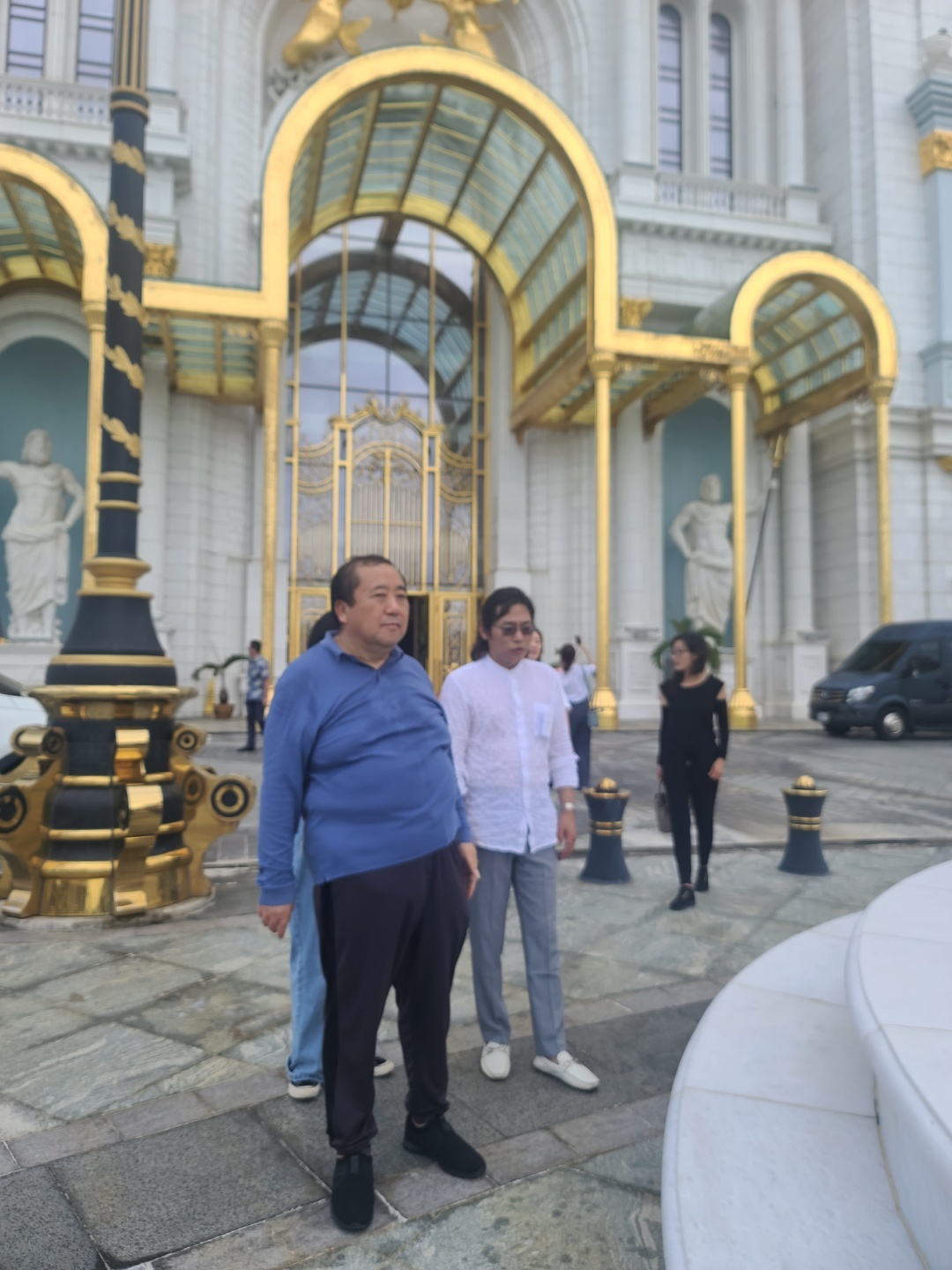 Imperial Pacific International board adviser Hongtao Su, left, accompanies IH Group Chairman Kyunam Kim during a tour of the IPI casino and unfinished hotel tower in Garapan.