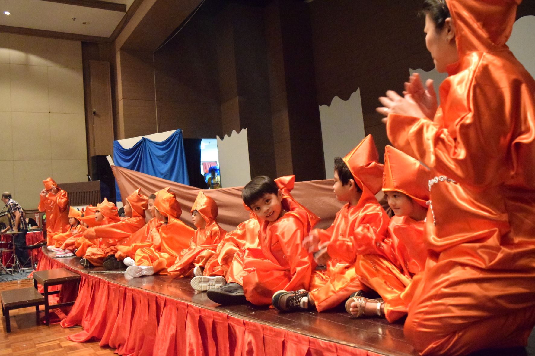Kinder 5 children with teachers Maricel Javier, right, and Anarin Abad left, portray playful squids.