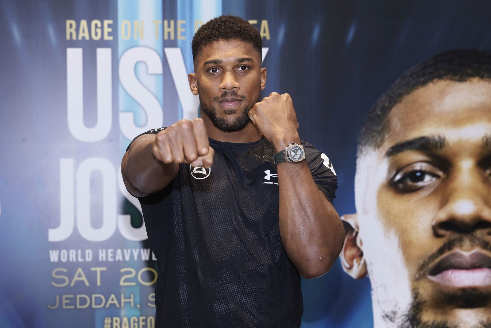 Anthony Joshua poses during the media event for his upcoming  WBA, WBO and IBF heavyweight world title match against Oleksandr Usyk  in Jeddah, Saudi Arabia, Aug. 15, 2022