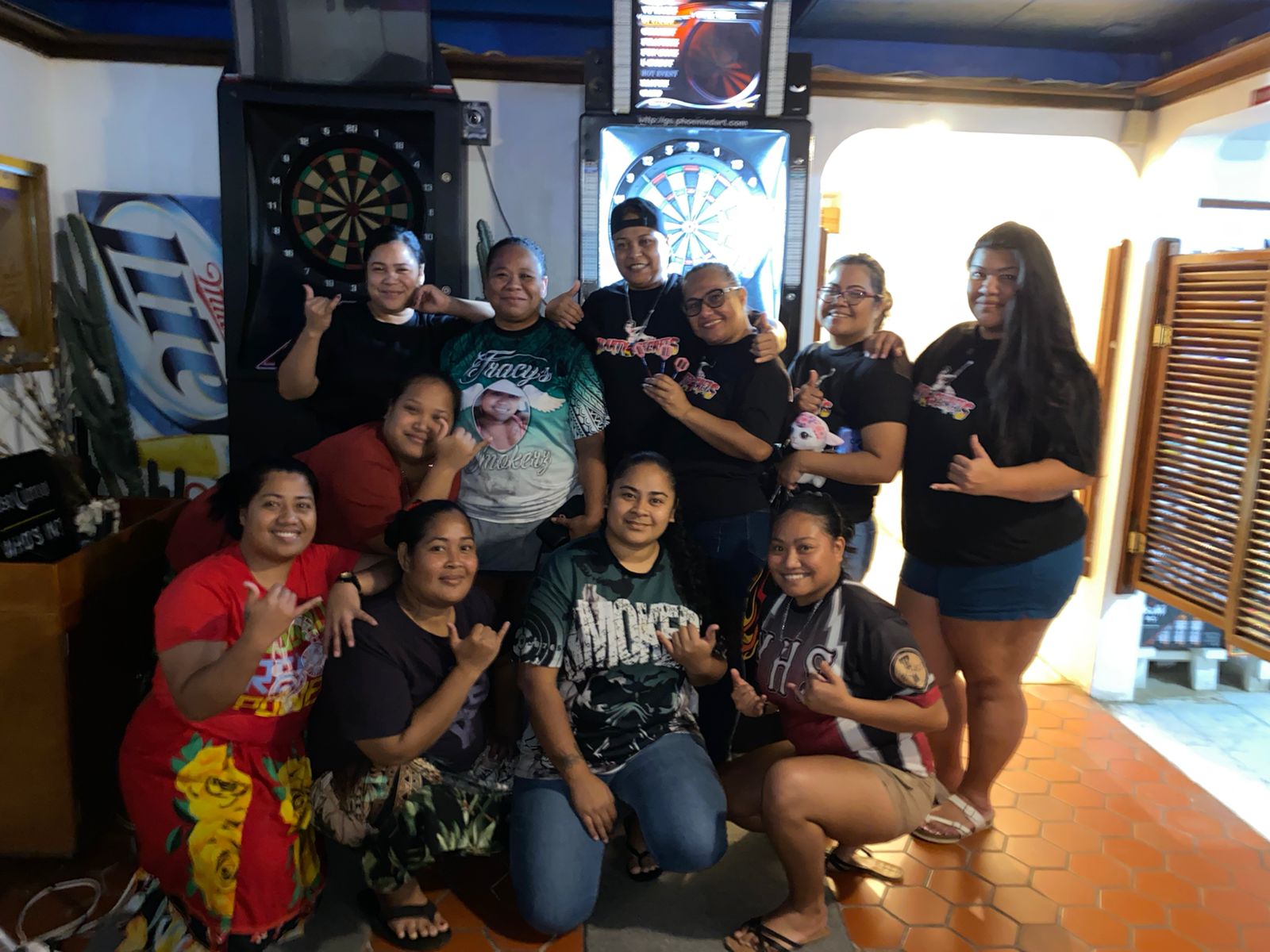 The Oleai Tracy's Smokerz and Last Shot Darty Secret pose for a photo after their match on Monday in the Ladies Division of the SEDA Bud Light Dart League at Oleai Sports Bar & Grill.