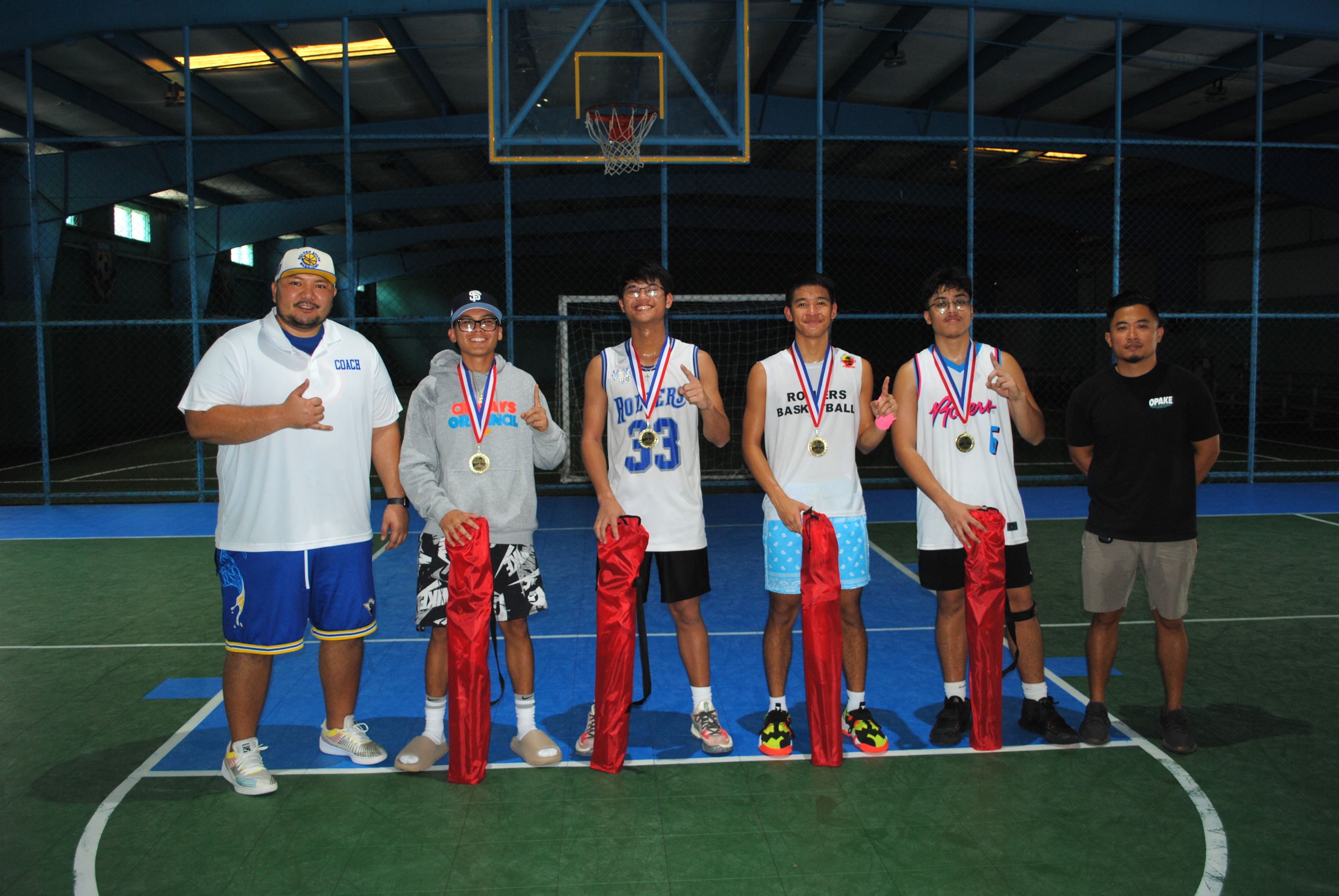 The Bench Buddies pose with their first place medals and prizes. Also in photo are NMI Basketball Federation Vice President  Dave Apatang  and board member Mike Mercado.