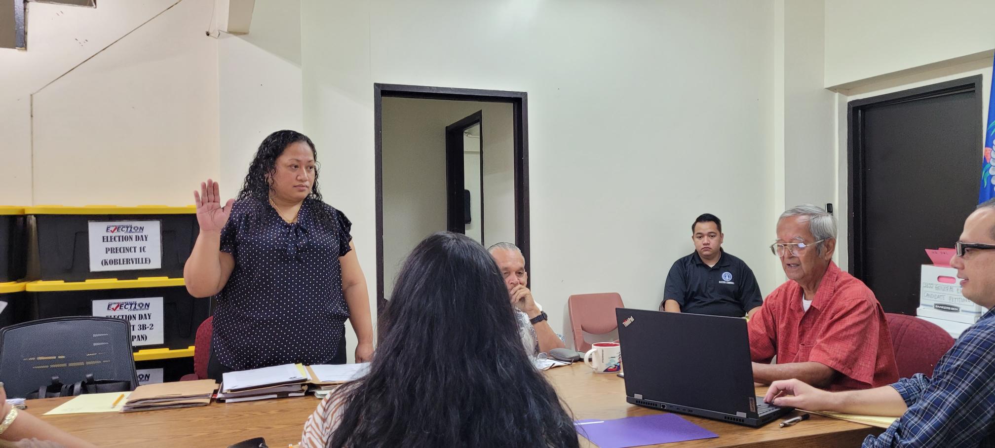 Commonwealth Election Commission Executive Director Kayla S. Igitol is sworn in prior to providing testimony in the CEC board hearing on Rota mayoral candidate Alfredo Taisacan Taimanao.