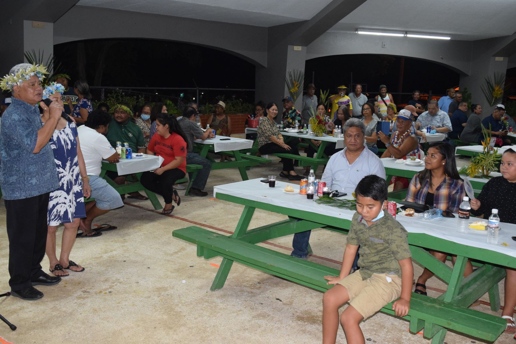 Independent gubernatorial candidate Lt. Gov. Arnold I. Palacios, left, speaks to his  supporters during the celebration of his 67th birthday on Friday at  Garapan Central Park.