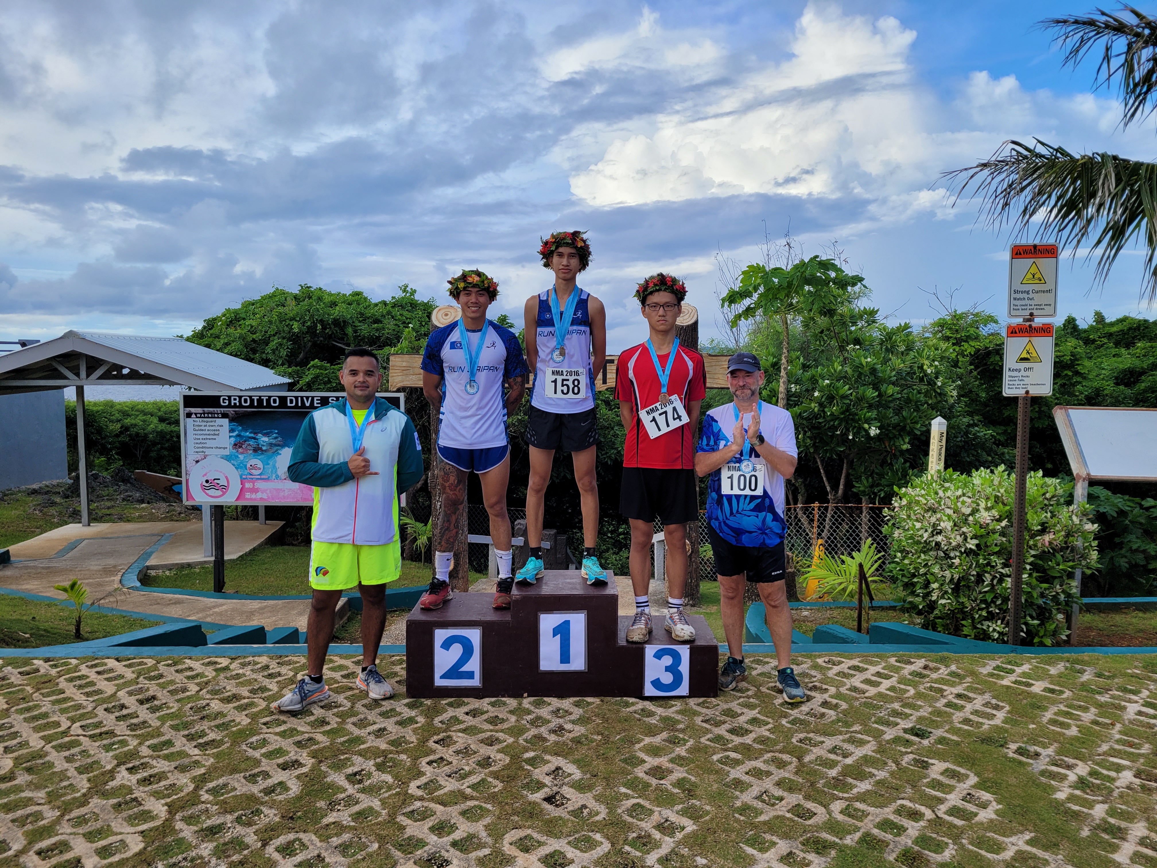 Run Saipan Run Saipan President Edward Dela Cruz Jr and Secretary/Treasurer Dr. Ron Snyder pose for a photo with the top three male runners Michael Mancao, Sildrey Veloria and David Zhao during the Grotto 10K award ceremony on Saturday at the Grotto.