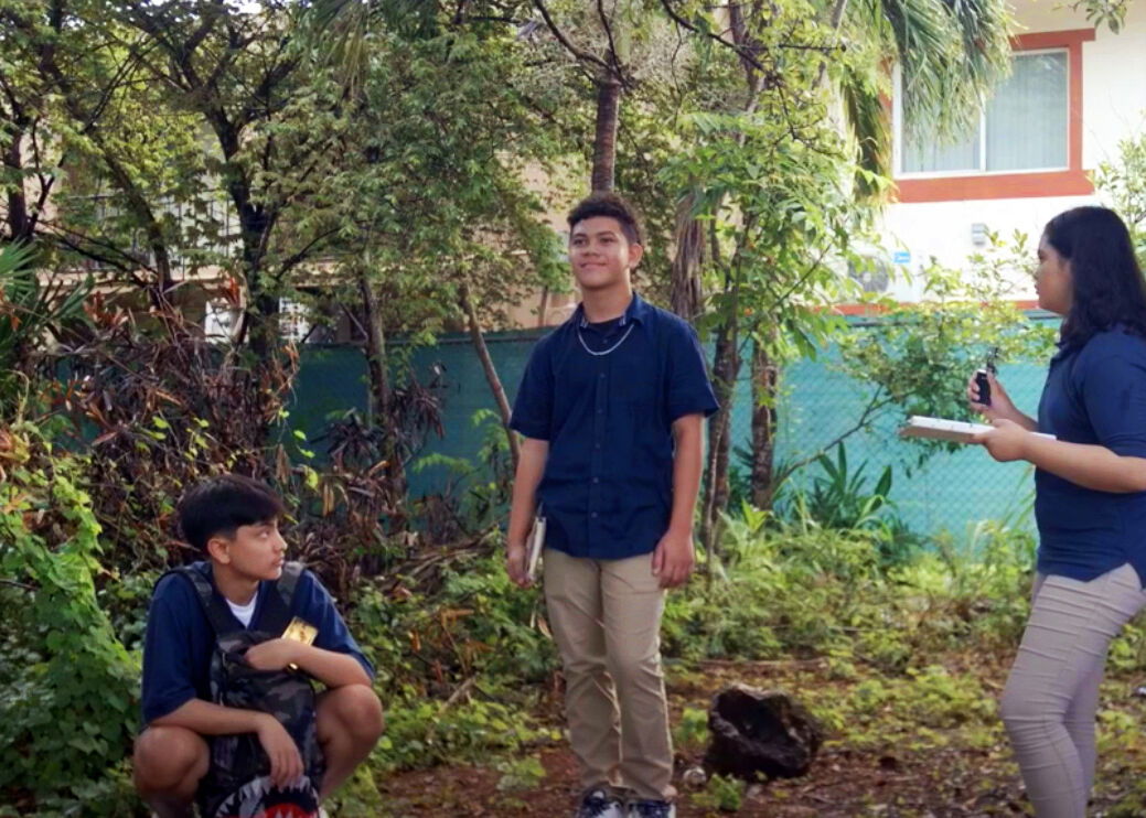 Local actors appear in a video from the Fuetsan Manhoben Youth Substance Use Prevention Program developed by a University of Guam research team. This video depicts a scene outside a school bus stop. The Fuetsan Manhoben curriculum is based on research that found that some Guam adolescents are exposed to e-cigarettes at bus stops. The video-based curriculum aims to help students think critically about drug-resistance strategies.  