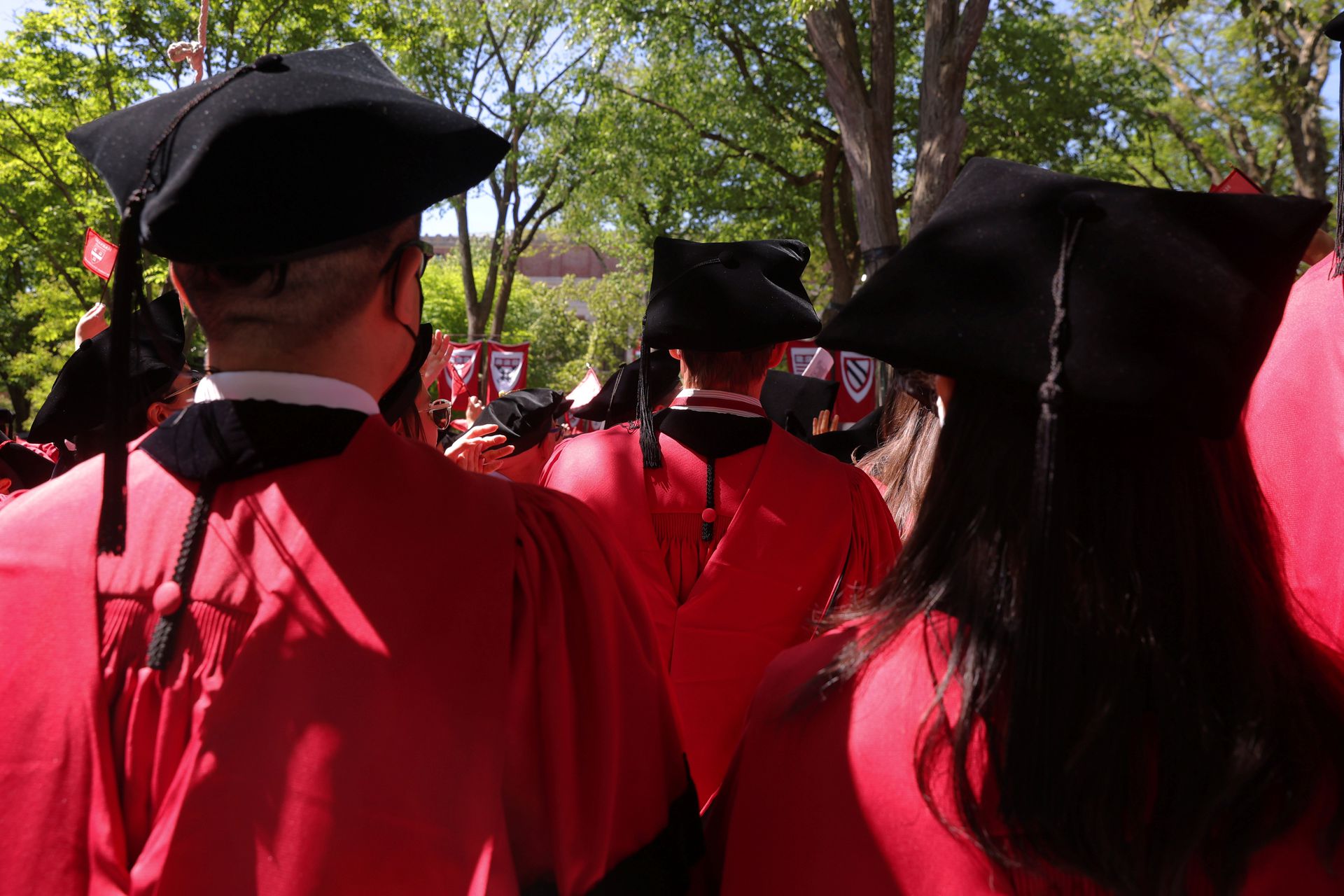 Graduating students stand during Harvard University's 371st Commencement Exercises in Cambridge, Massachusetts, May 26, 2022.