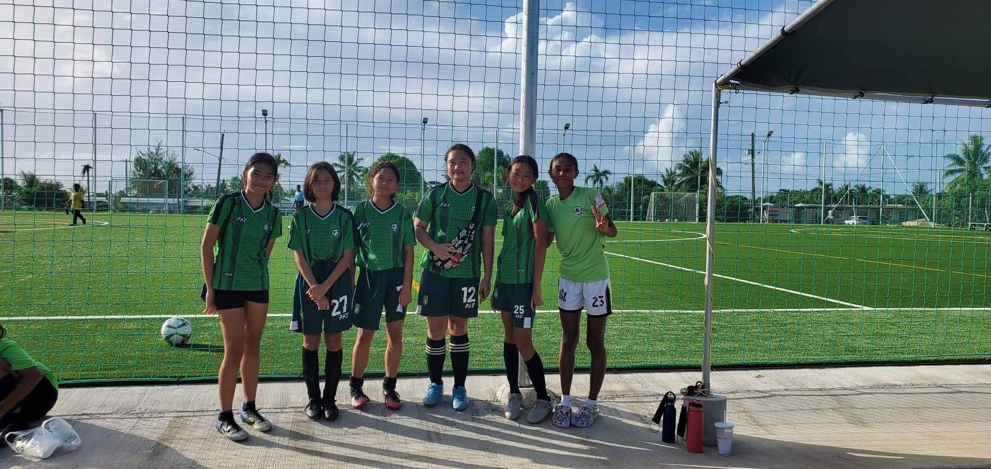 Tan Holdings Football Club players pose for a photo after winning the U13 Girls Division title of the 2022 Youth Summer Cup  Saturday at the NMI Soccer Training Center in Koblerville.