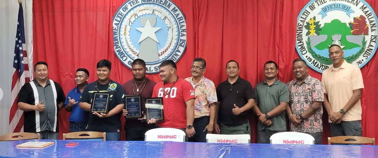 Tyric Castro, Mamet Manglona and Damian Atalig hold their plaques on Aug. 9. Also in photo are Rota Mayor Efraim M. Atalig, Gov. Ralph DLG Torres, CNMI Homeland Security Emergency Management Special Assistant Dennis C. Mendiola, House Minority Leader Angel Demapan, and other Rota officials.