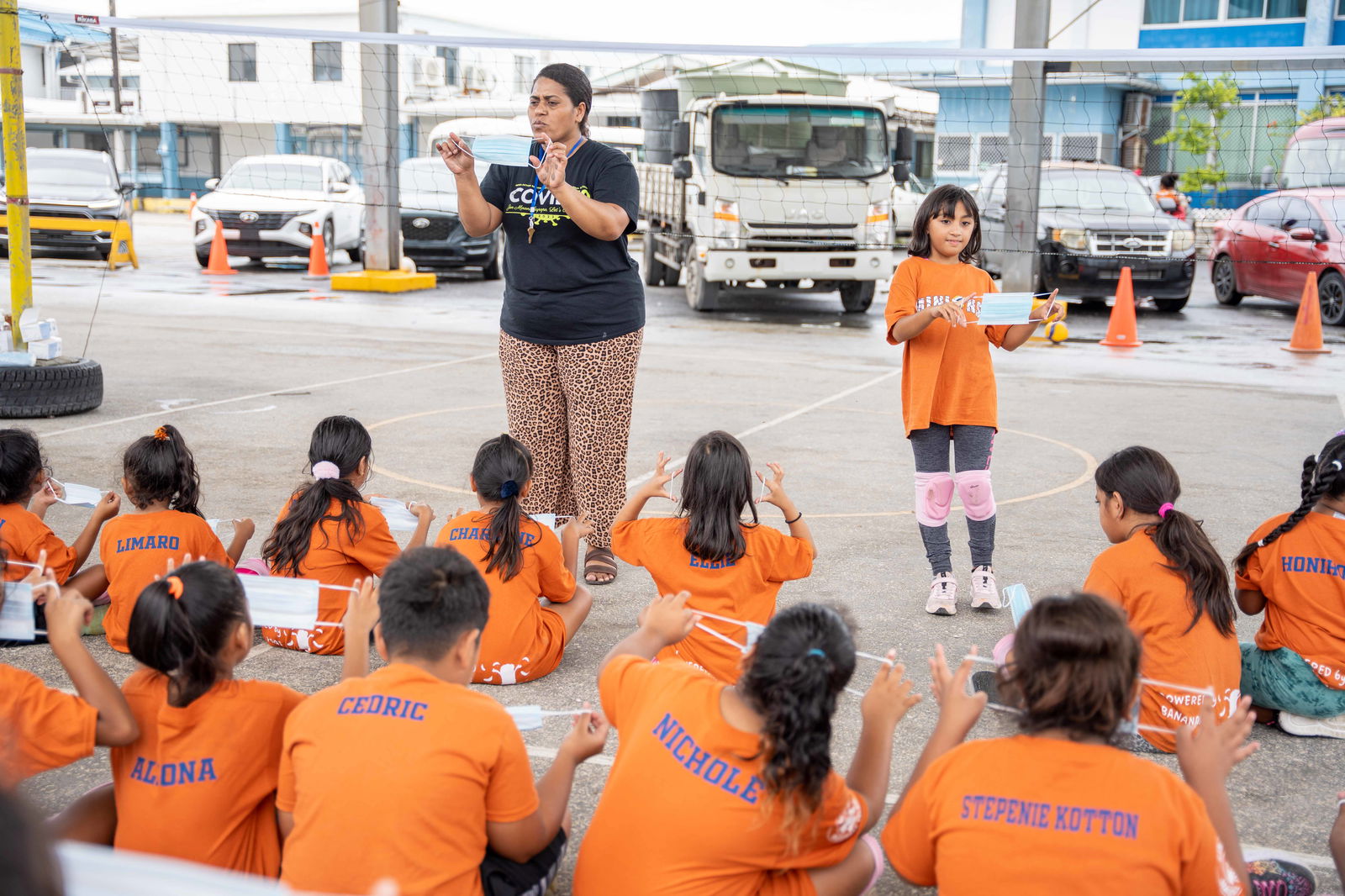With the arrival of Covid in the Marshall Islands looming, Ministry of Health and Human Services nurse Nolau Lutunatabua and youthful helper Barwa Jacklick demonstrated Friday last week to a group of children involved in a volleyball training program how to properly use face masks.