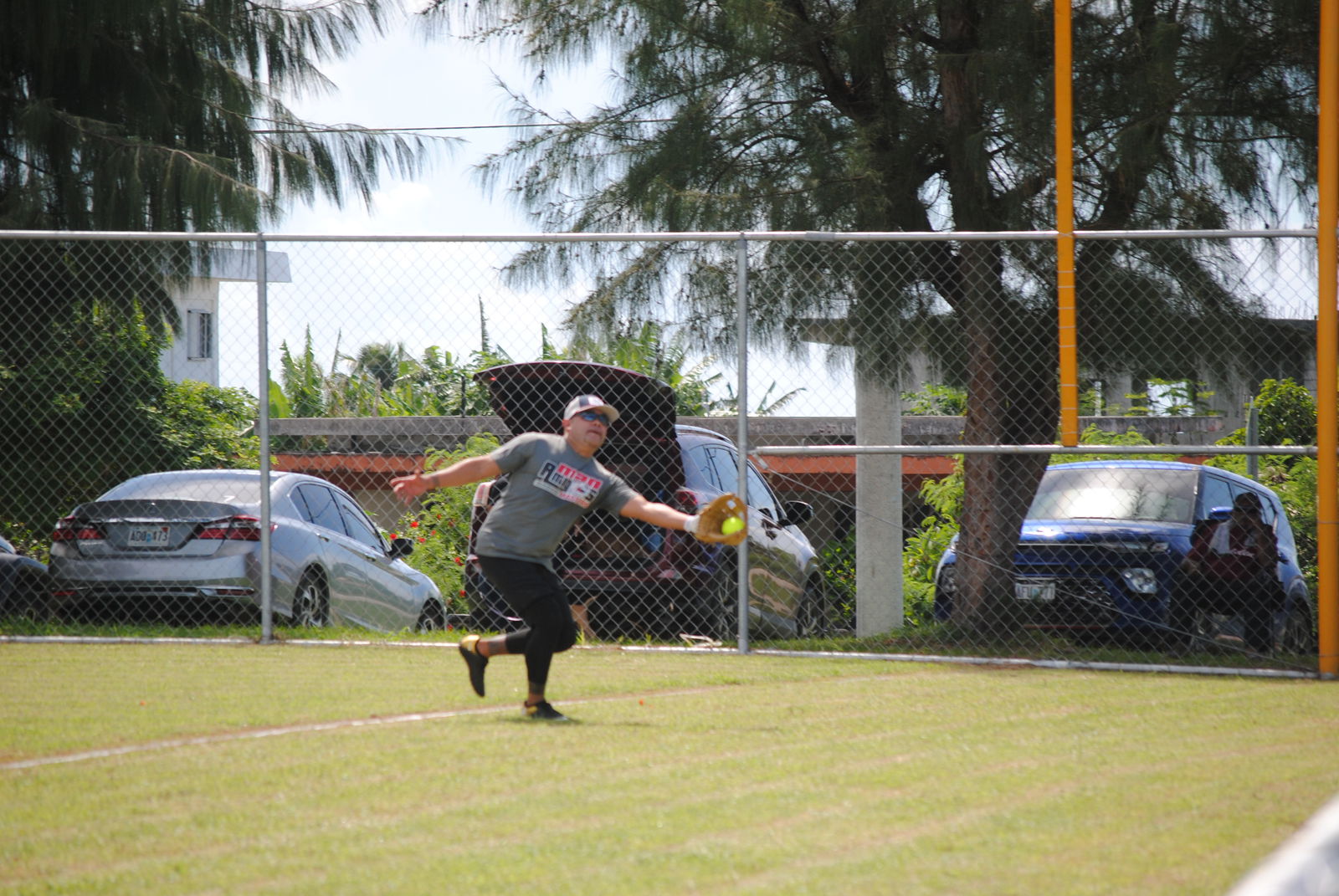 The Man Amigos' Vinnie Sablan extends to catch the fly ball at the right outfield during a 2022 Budweiser Belau Amateur Softball League game Sunday at the Dandan baseball field.