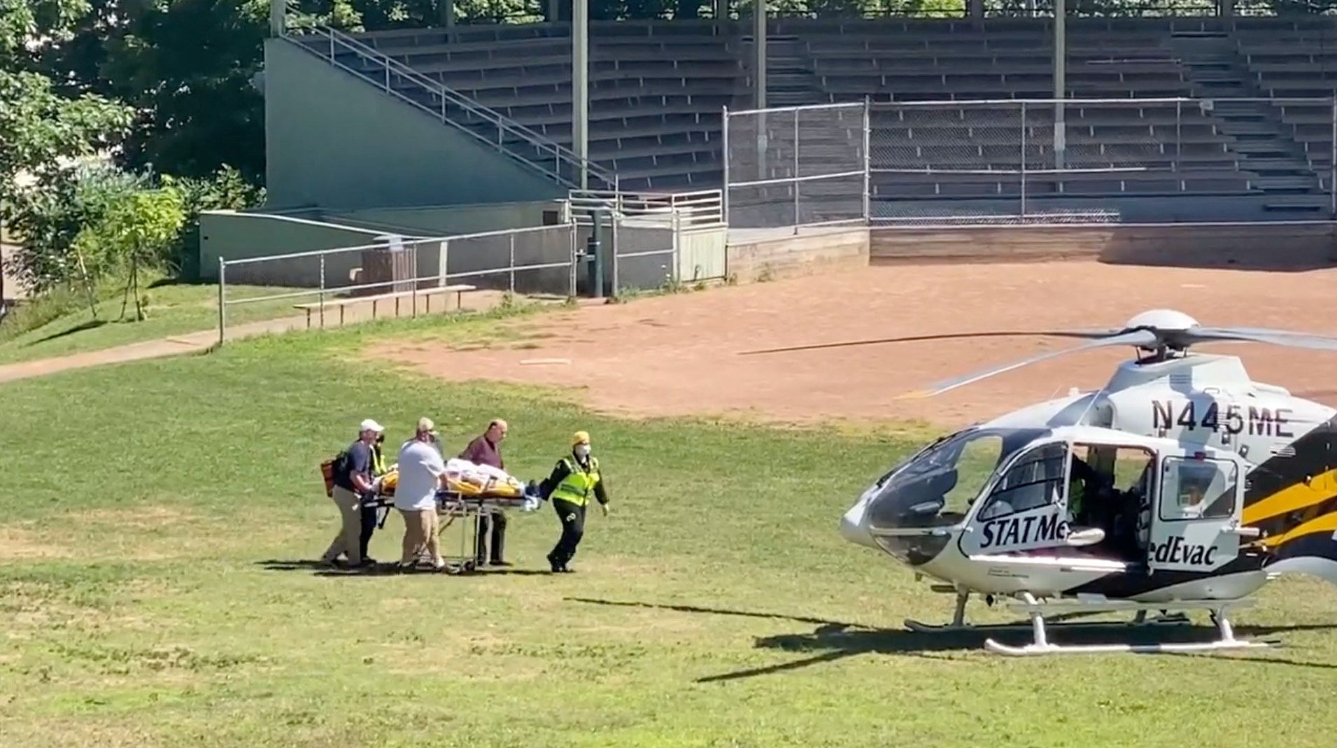 Author Salman Rushdie is transported to a helicopter after he was stabbed on stage before his scheduled speech at the Chautauqua Institution, Chautauqua, New York, Aug. 12, 2022, in this screengrab taken from a social media video.