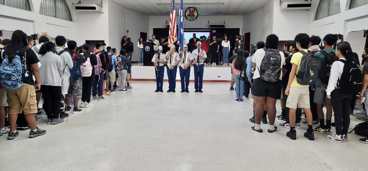 Tinian Jr. Sr. High School held an indoor flag raising ceremony led by its JROTC cadets. Photo also shows Board of Education Vice Chairman Antonio Borja, standing center, back ground, with  Principal Liz Hofschneider and Vice Principal Nikita Mendiola.